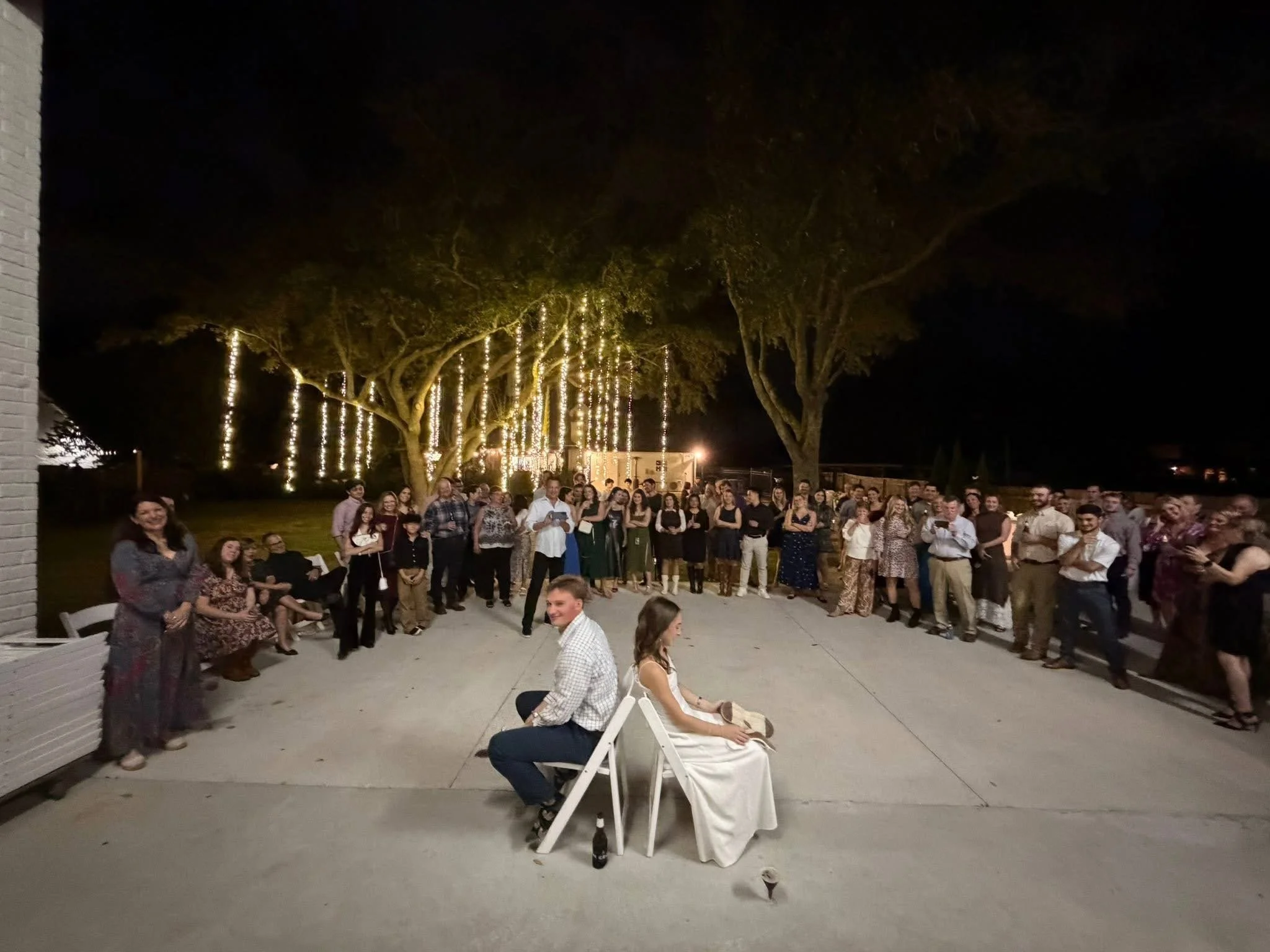 white-string-lights-hanging-oak-trees-outdoor-wedding.jpg