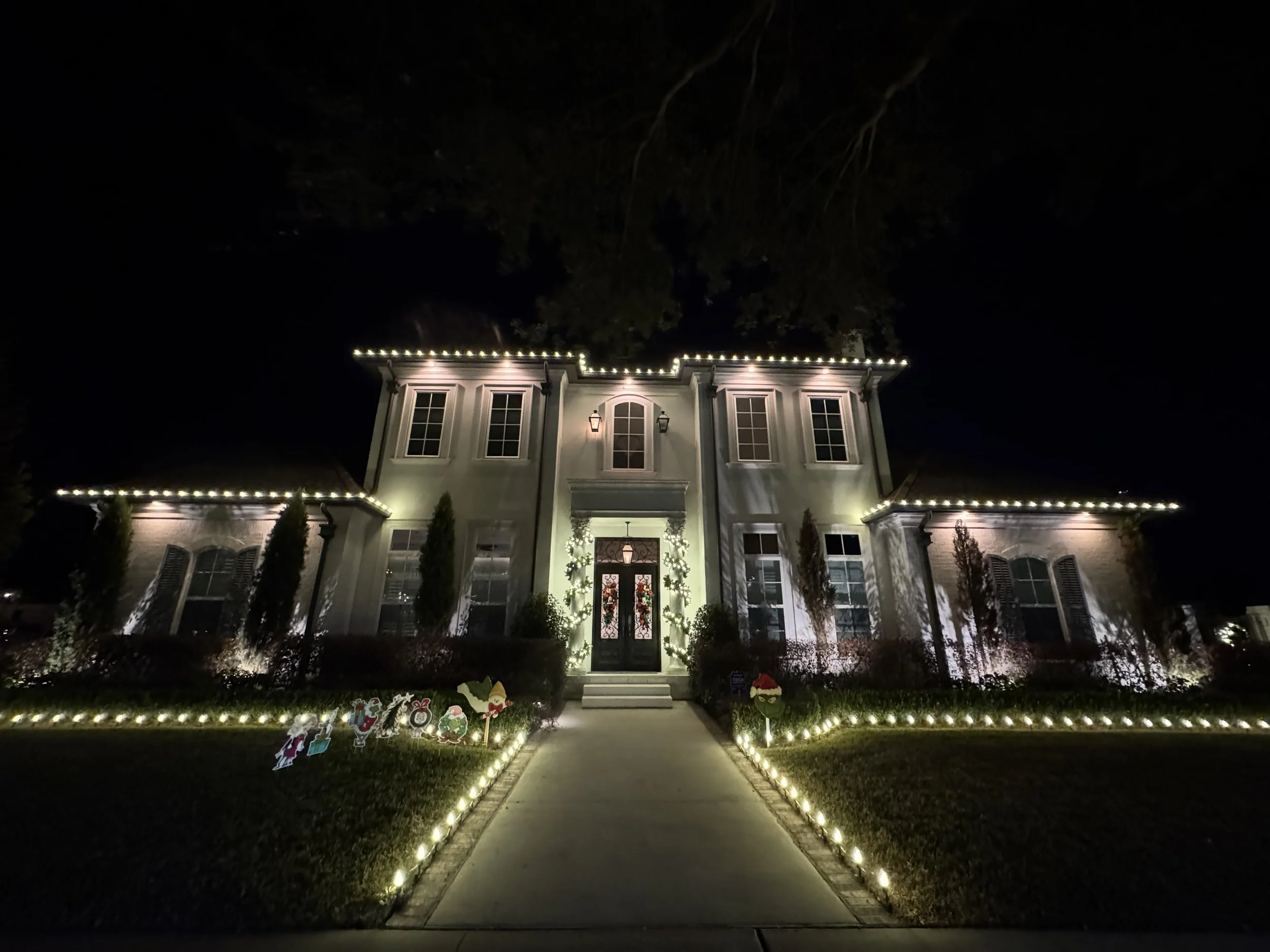 white-christmas-lights-two-story-house-walkway.jpg