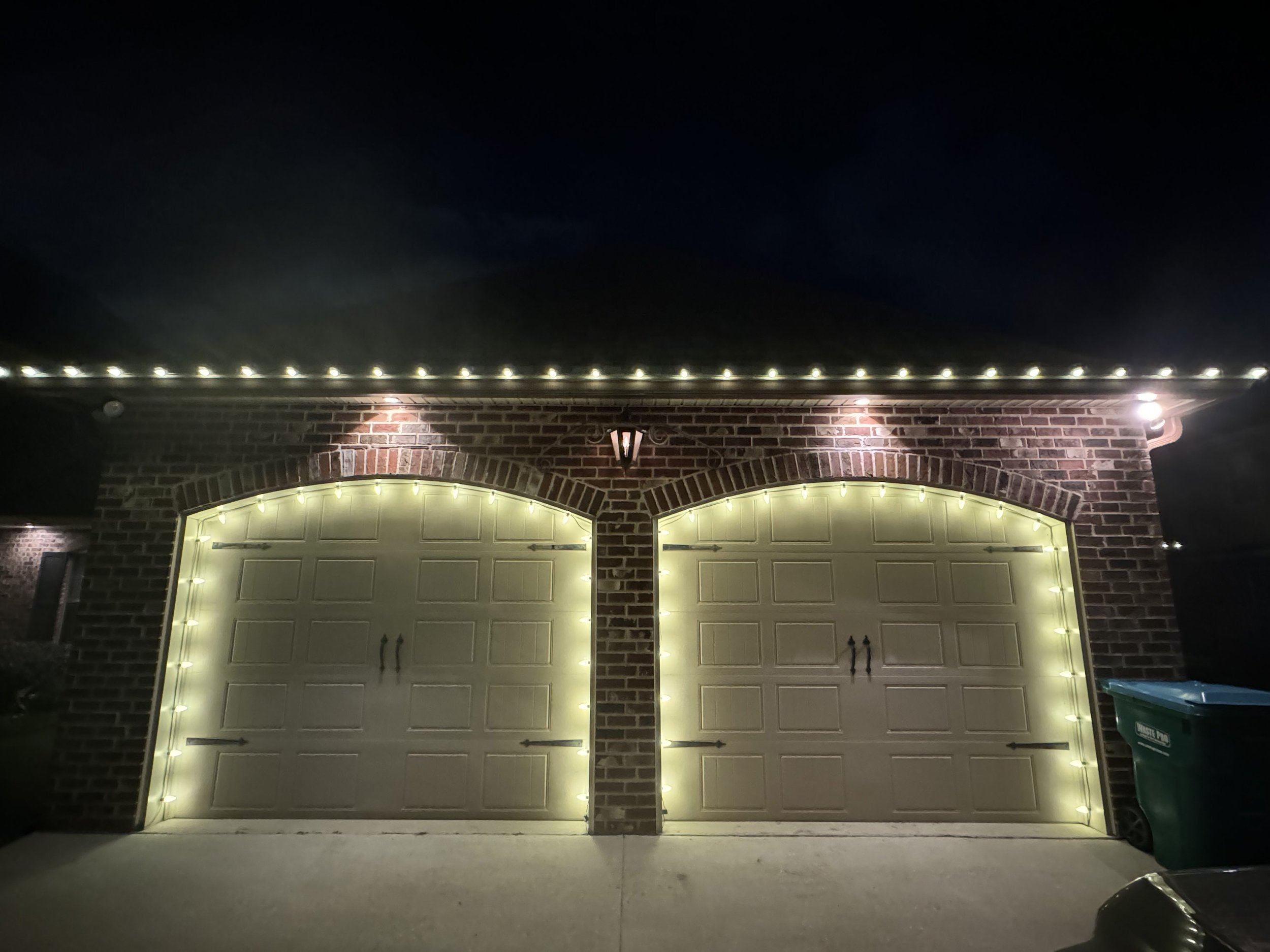 warm-white-christmas-lights-brick-garage.jpg