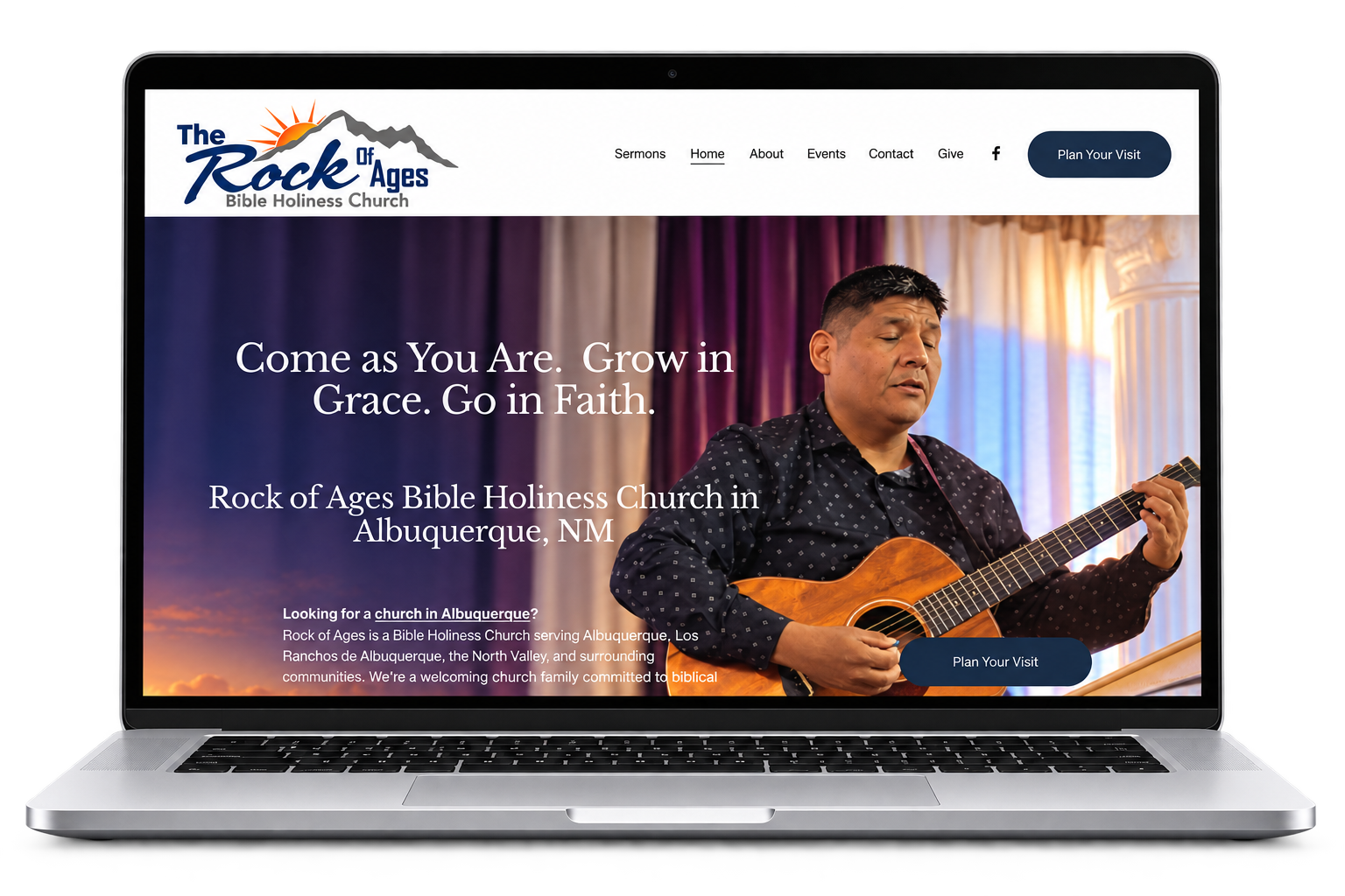 Laptop displaying the Rock of Ages Bible Holiness Church website, featuring a guitarist and Albuquerque, New Mexico church information.