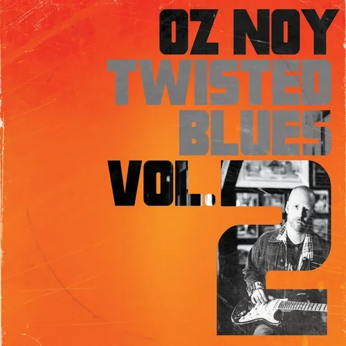 Album cover titled 'Oz Noy Twisted Blues Vol. 2' with an orange background, black and gray text, and a black-and-white photo of Oz Noy playing an electric guitar.