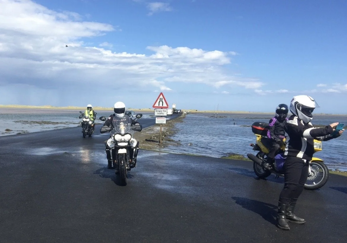 website holy island causeway and bikers.jpg