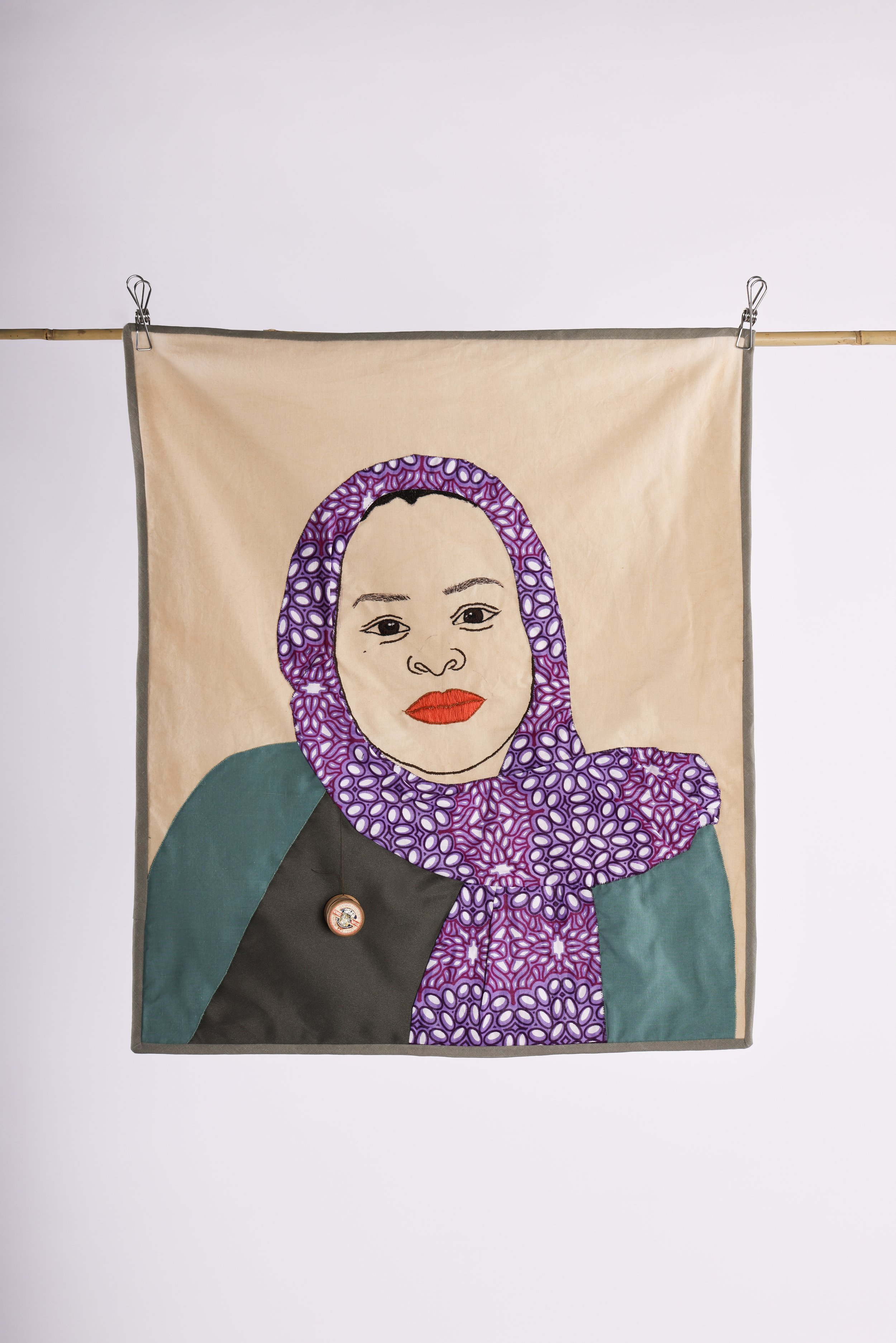 Shattering stereotypes, 2025, hand embroidery and appliqué on coffee stained cotton, quilt - 55 x 63cm
