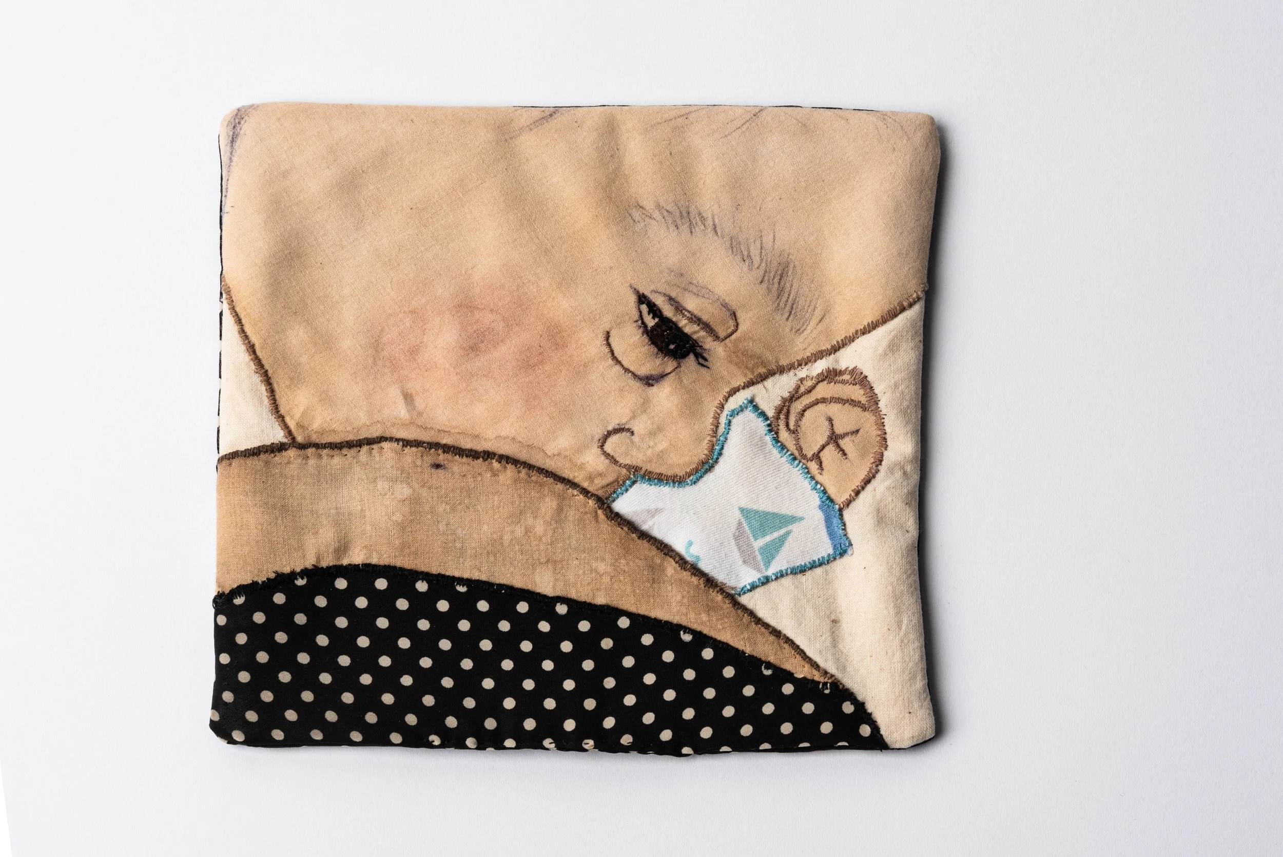 Title - Breastfeeding, 2023, hand embroidery and appliqué on coffee stained cotton, quilt