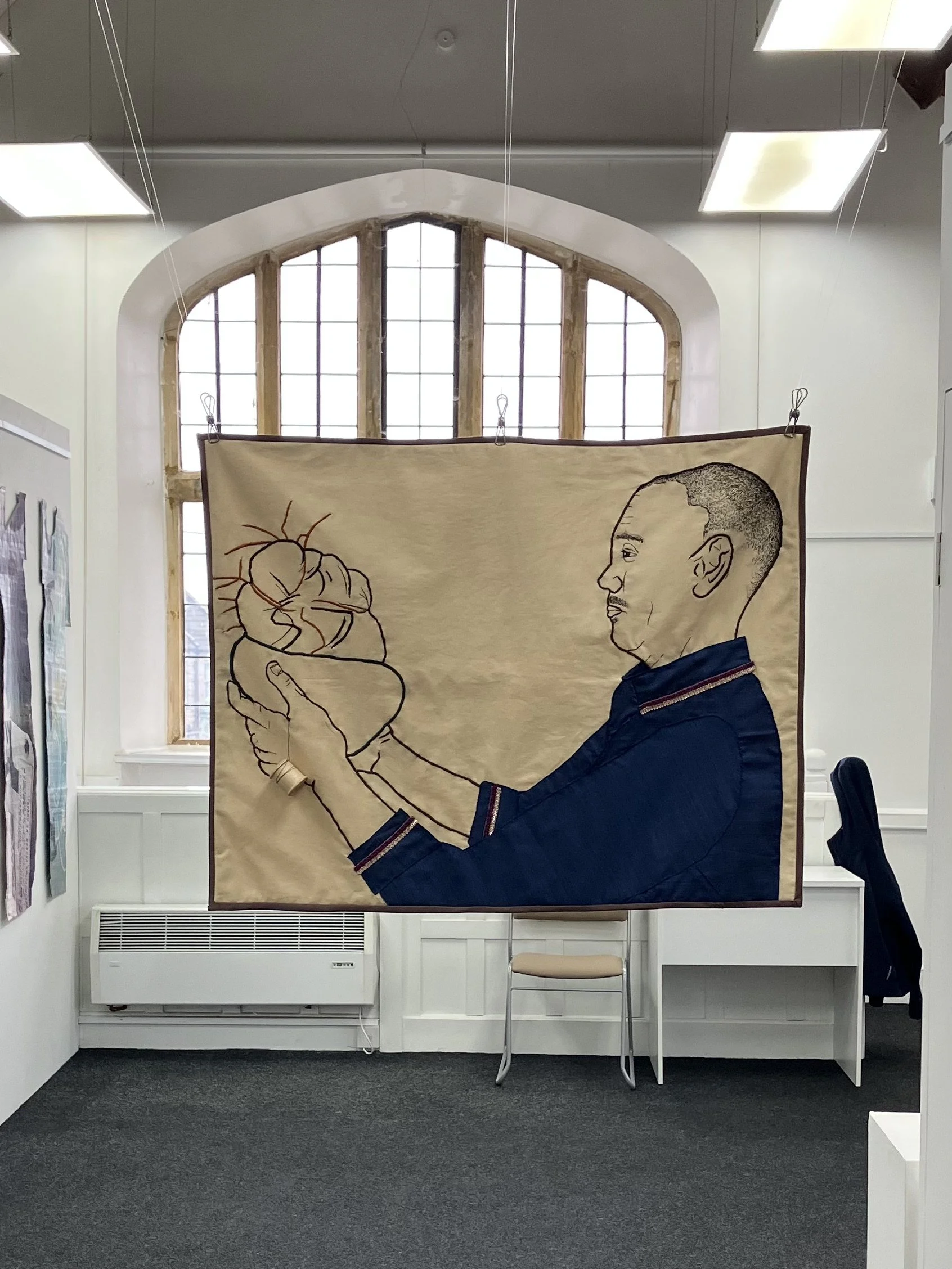 Time for reflection, 2025, hand embroidery and appliqué on coffee stained cotton, quilt - 76 x 57cm