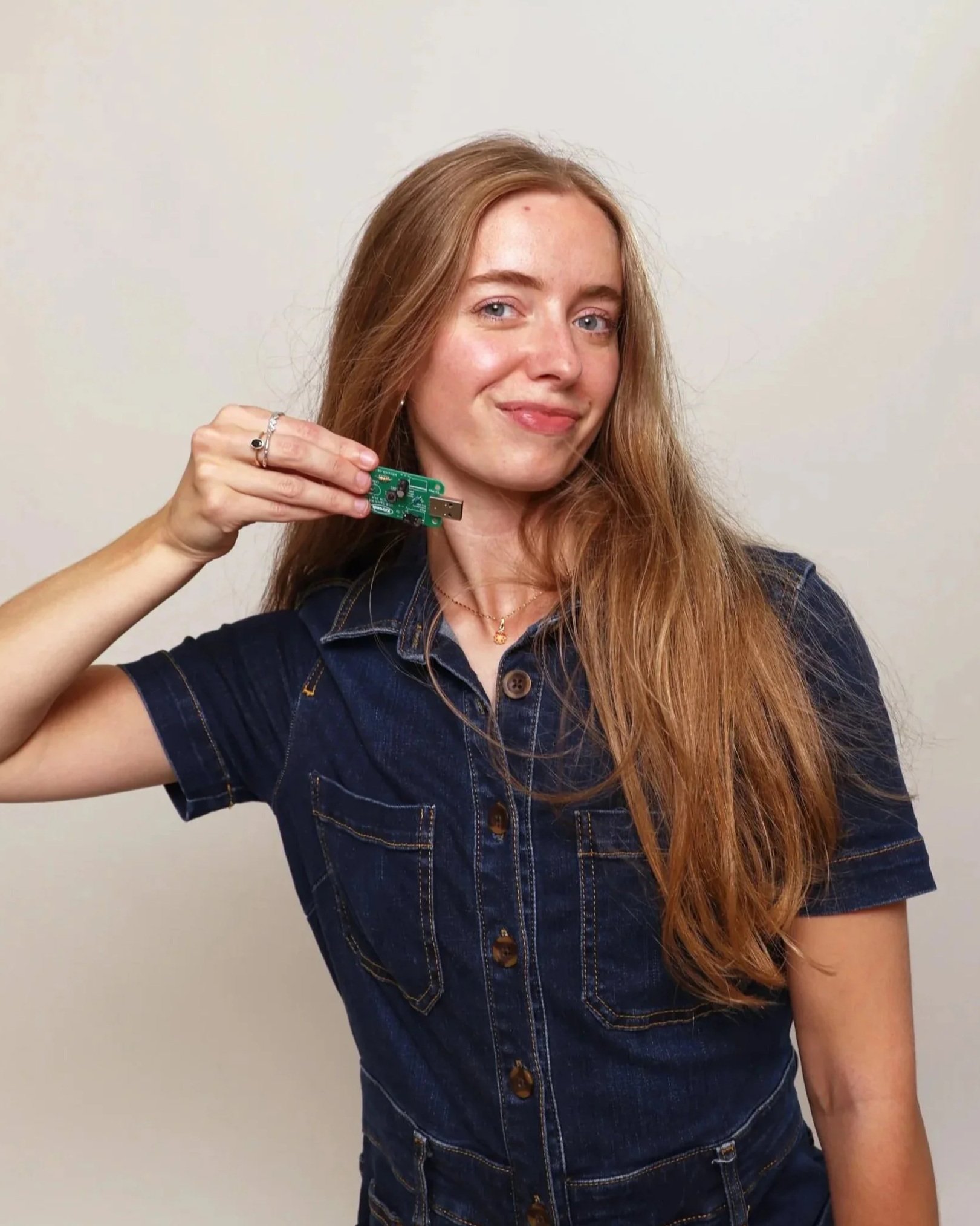 Victoria Sutton holding Rechargeable USB torch electronics project