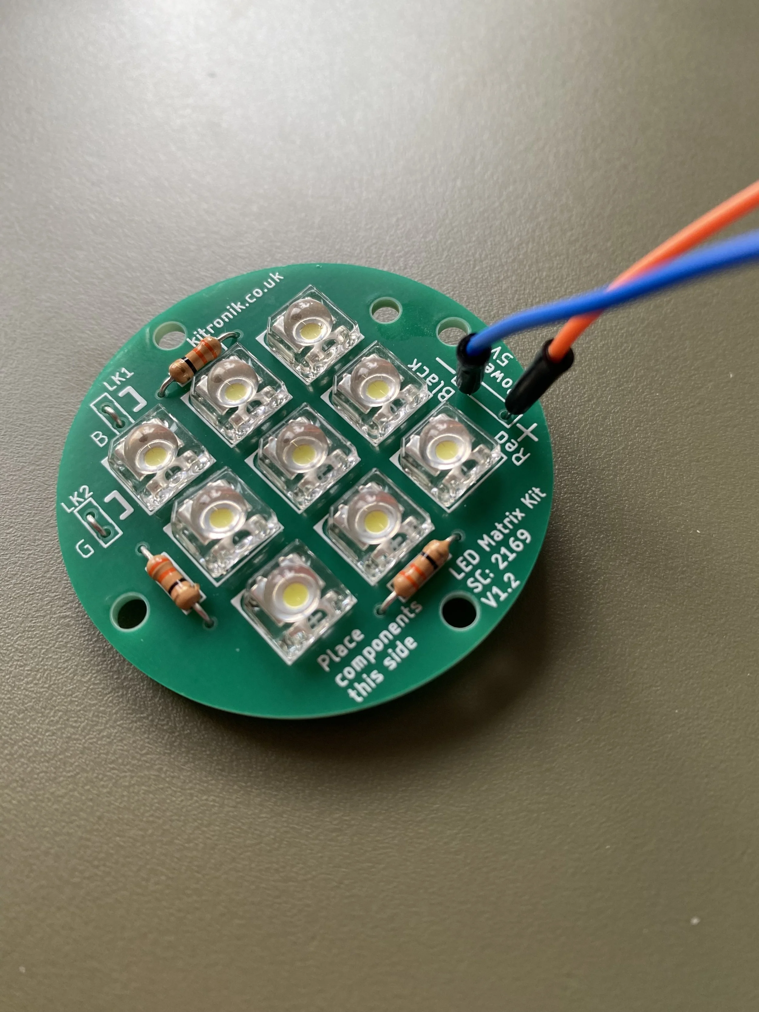 Round LED on green surface