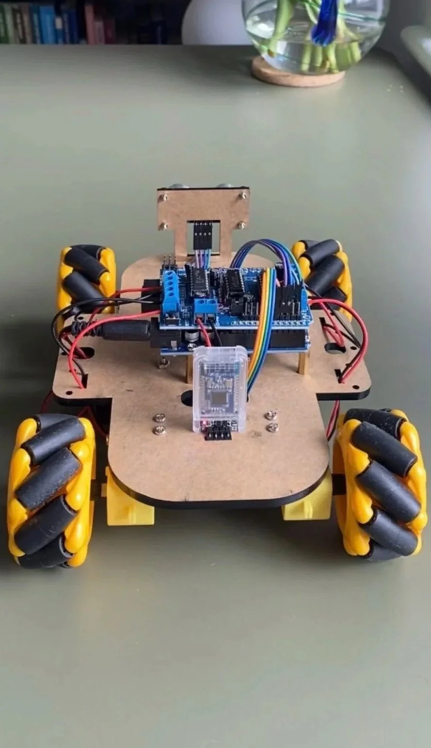 Robotic car showing components on green surface