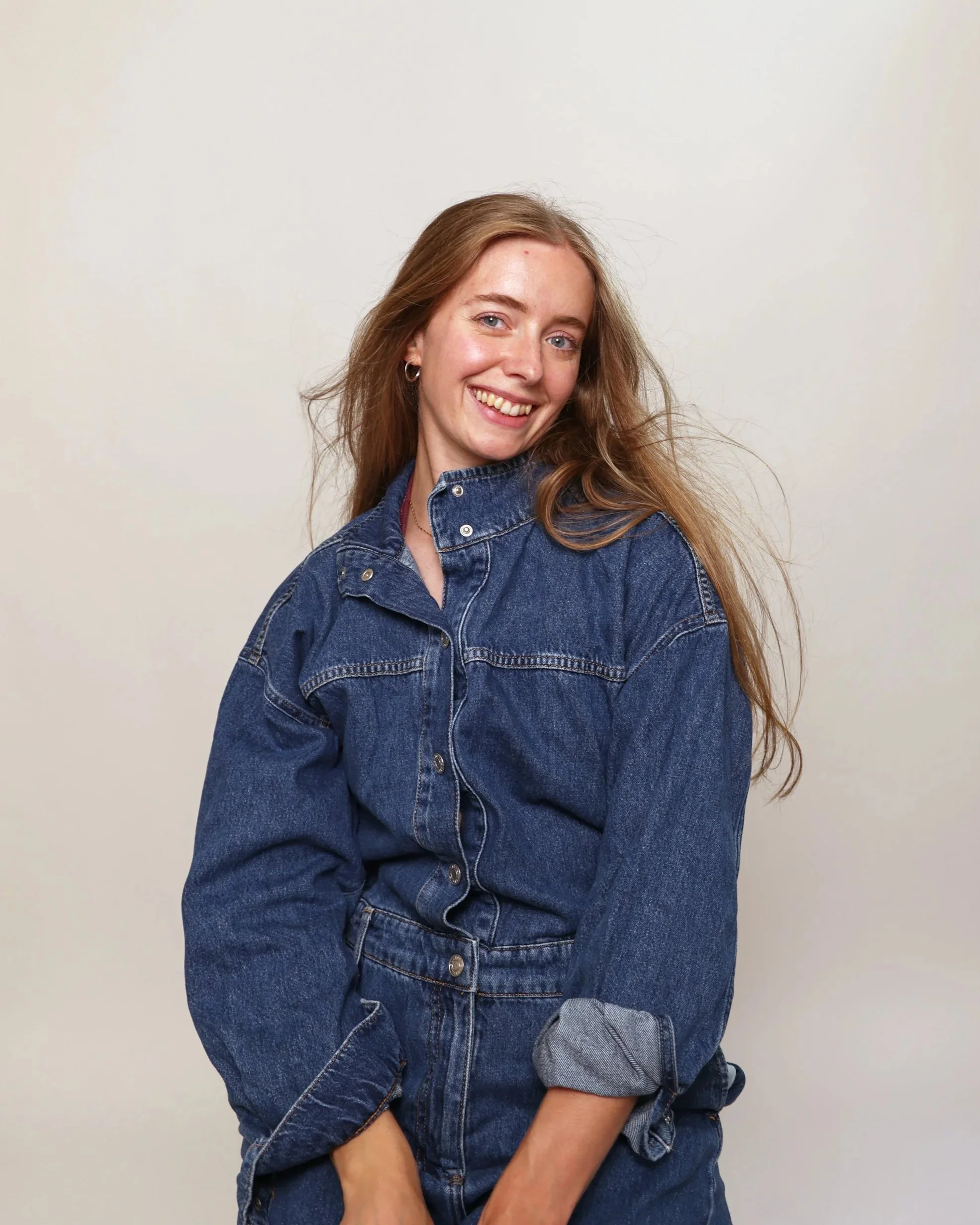 Portrait of Victoria Sutton dressed in blue dungarees