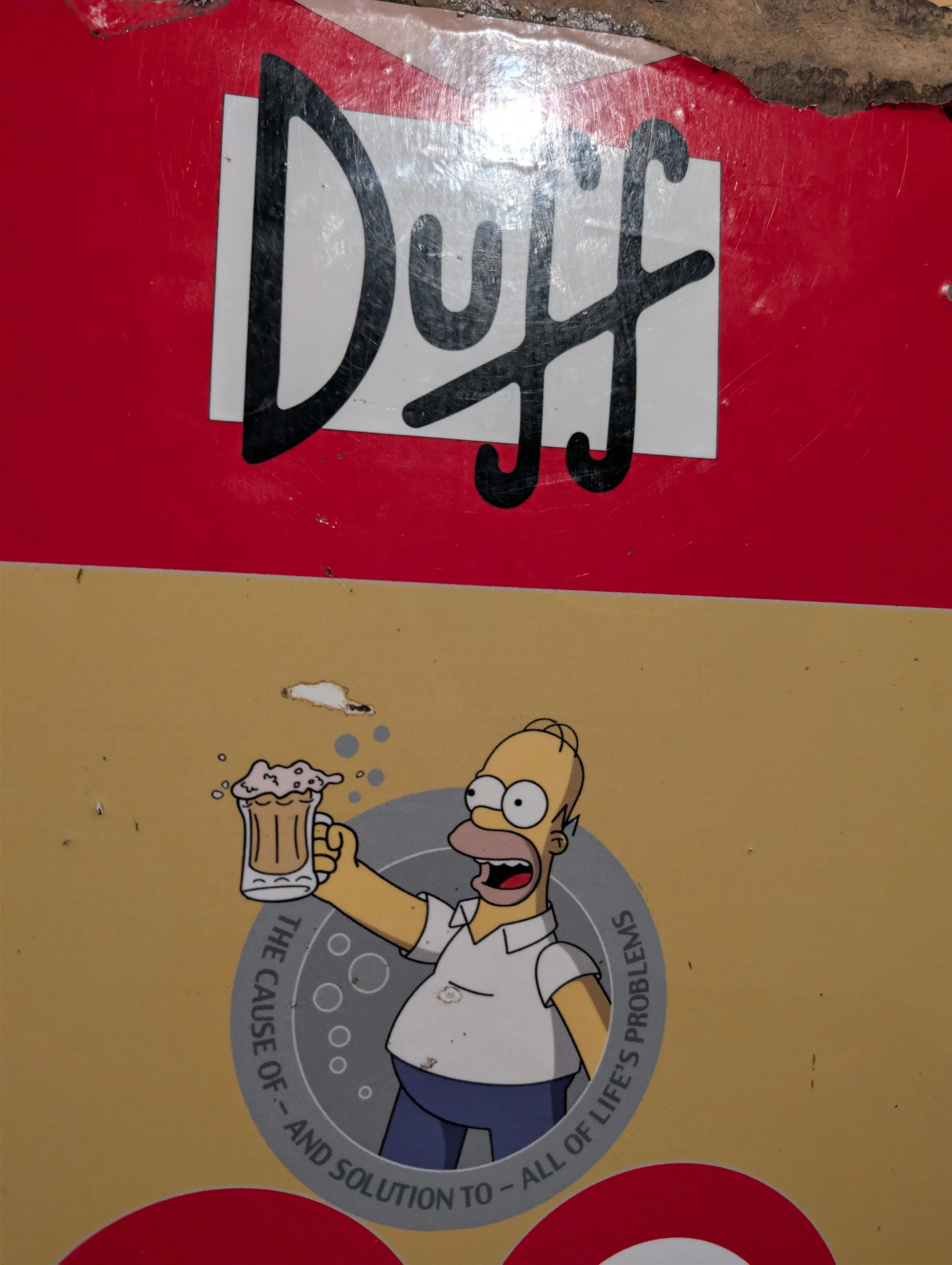 Cartoon character with glasses and a white shirt, holding a beer mug with foam on top, and looking surprised or excited. The background has a yellow and red color scheme, with various graphic elements.
