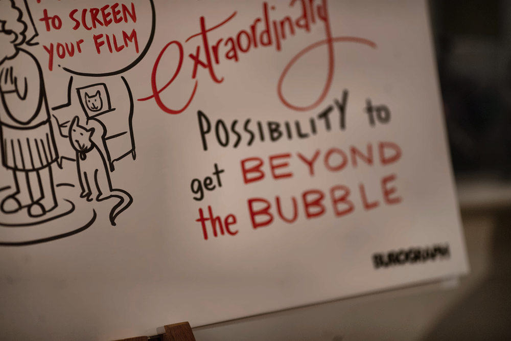 Poster reading “Extraordinary possibility to get beyond the bubble,” with cartoon illustrations and red-and-black lettering.