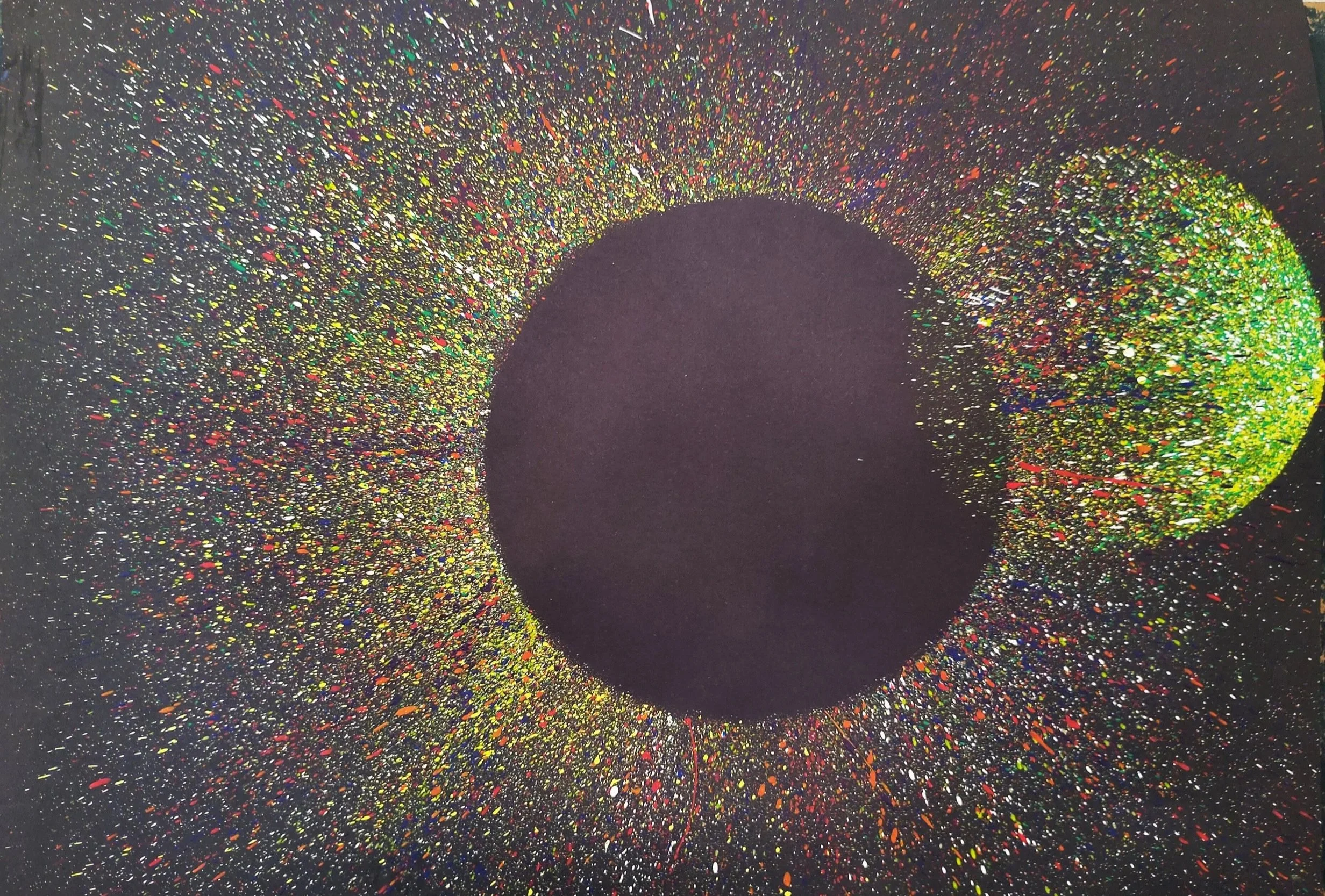 Abstract celestial planetary art, original painting with a large dark sphere and a secondary green splatter sphere surrounded by a rainbow burst of paint on a black background.