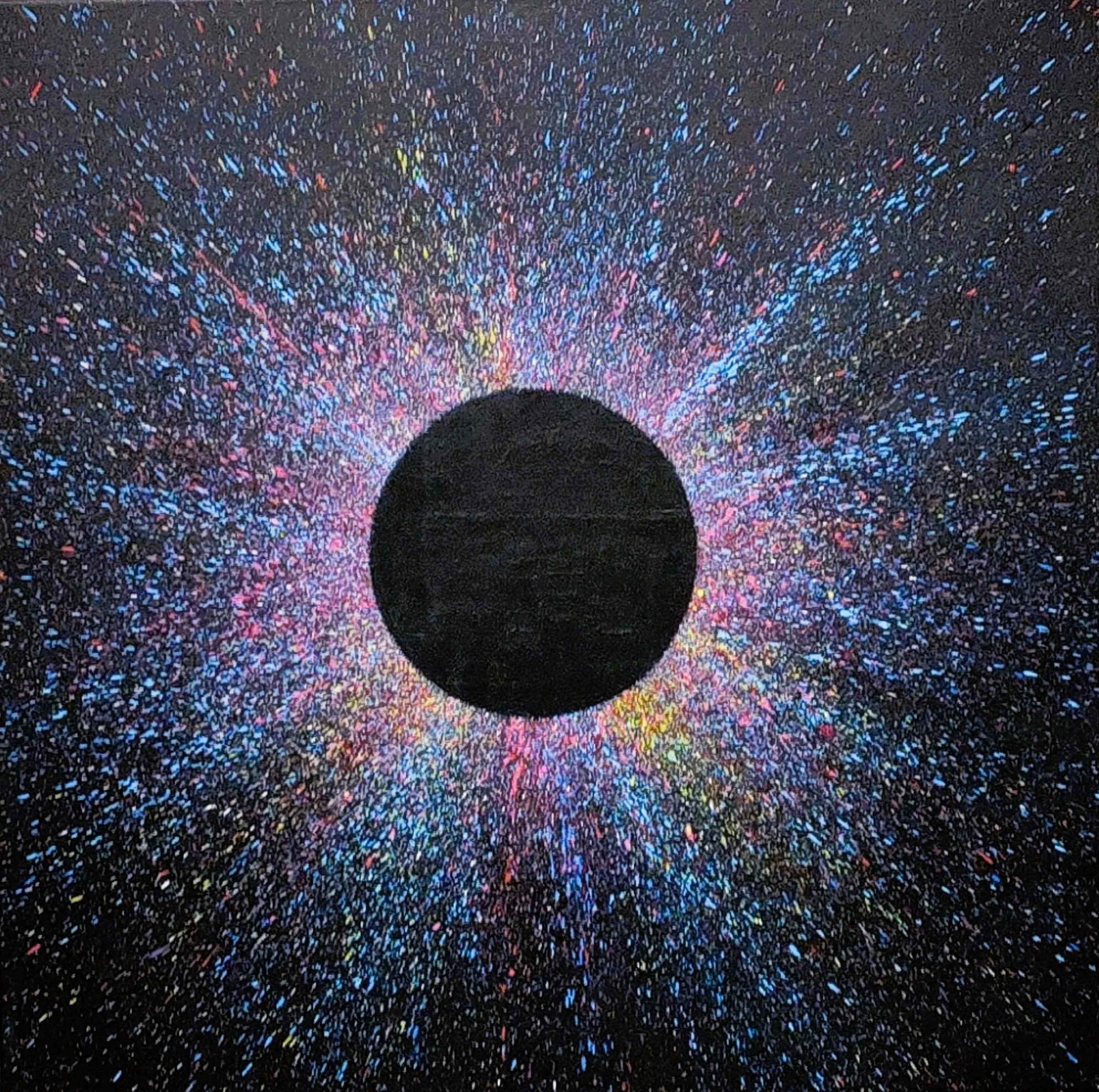 Colorful celestial abstract art, original splatter painting with pink, blue, and yellow paint flecks radiating from a central dark sphere on dark canvas.