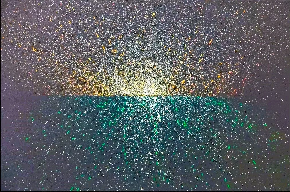 Original abstract landscape painting for sale, divided by a horizon line with radiant gold and orange splatter rising into a dark sky and emerald green paint specks reflecting onto dark water below.
