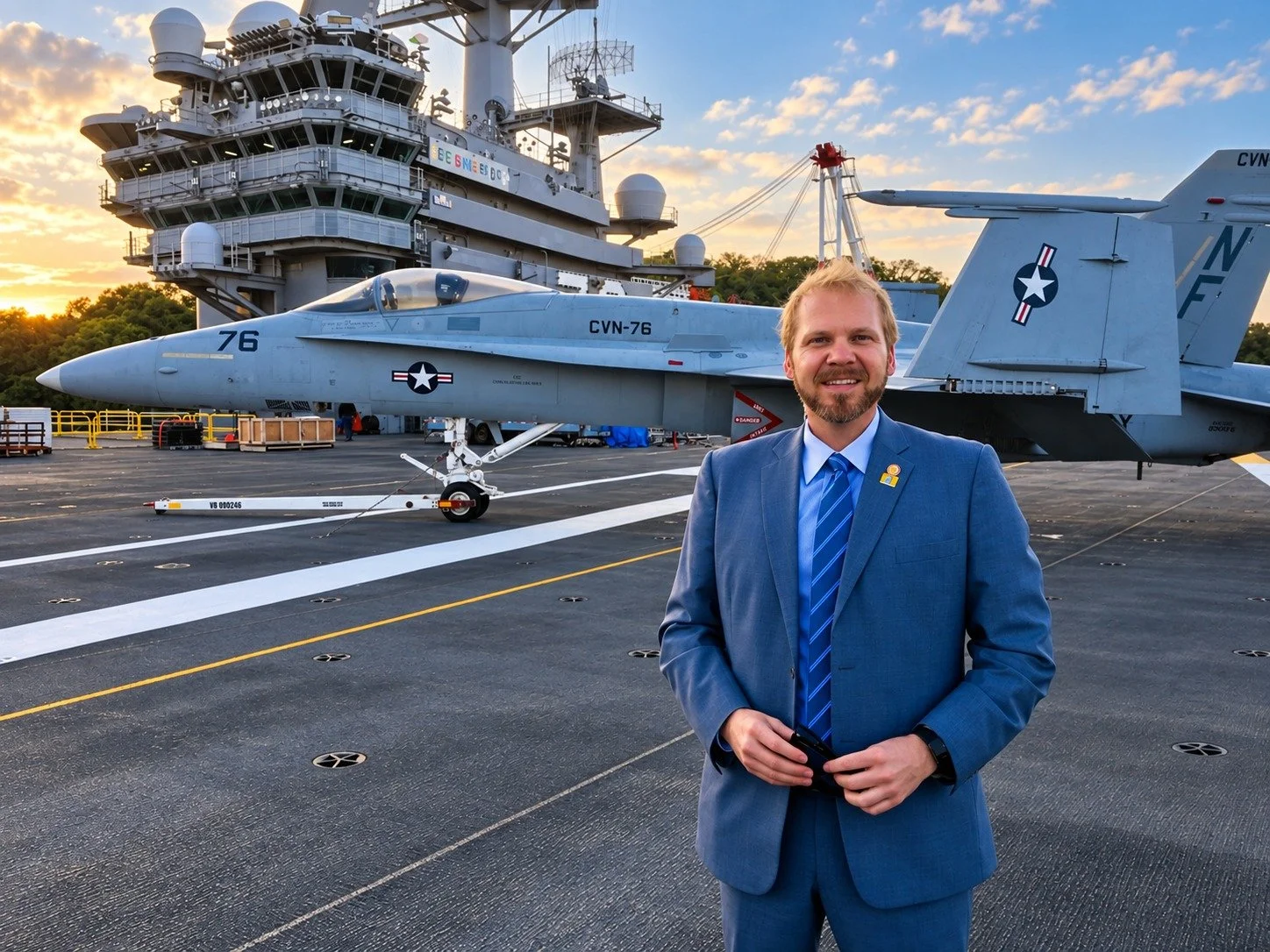 Tucker Axum aboard the USS Ronald Reagan in Japan with a fighter jet in the background