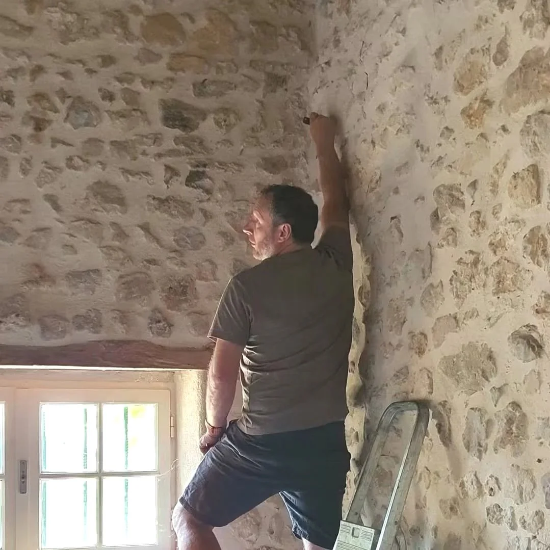 Pre-purchase renovation consultation inside a traditional stone property in south west France