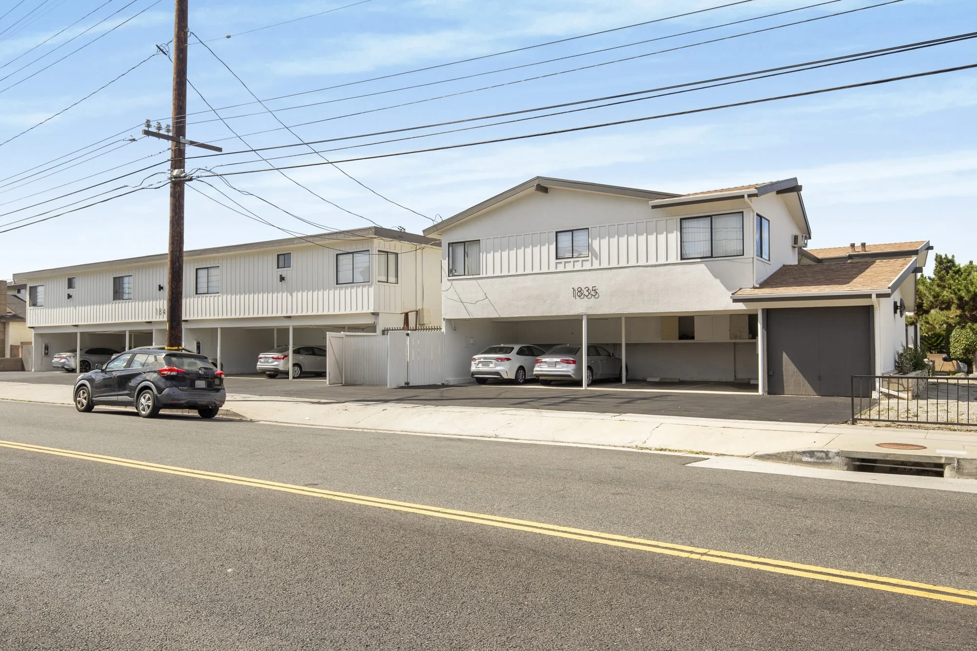 Apartment building street frontage with garages