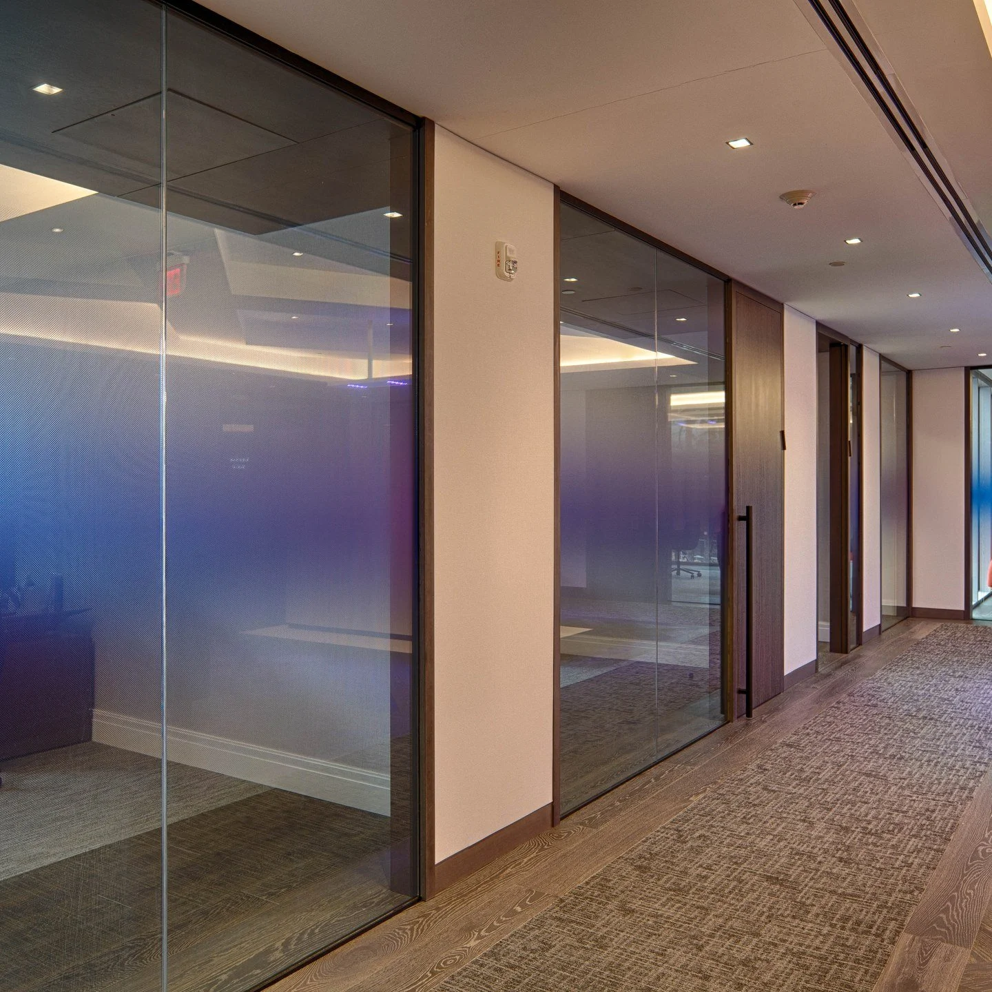 A glass wall does not have to be all the way clear or all the way blocked. A gradient glass film gives you the in between. We print a color that fades from solid to clear right on the glass, so you get privacy down low, open light up high, and a wash