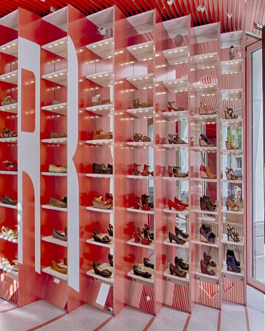 At Camper in SoHo, we finished the casework, millwork and ceiling panels in red 3M DI-NOC, an architectural film applied directly over the existing surfaces with no demolition. DI-NOC is available in hundreds of wood, stone, metal and solid color fin