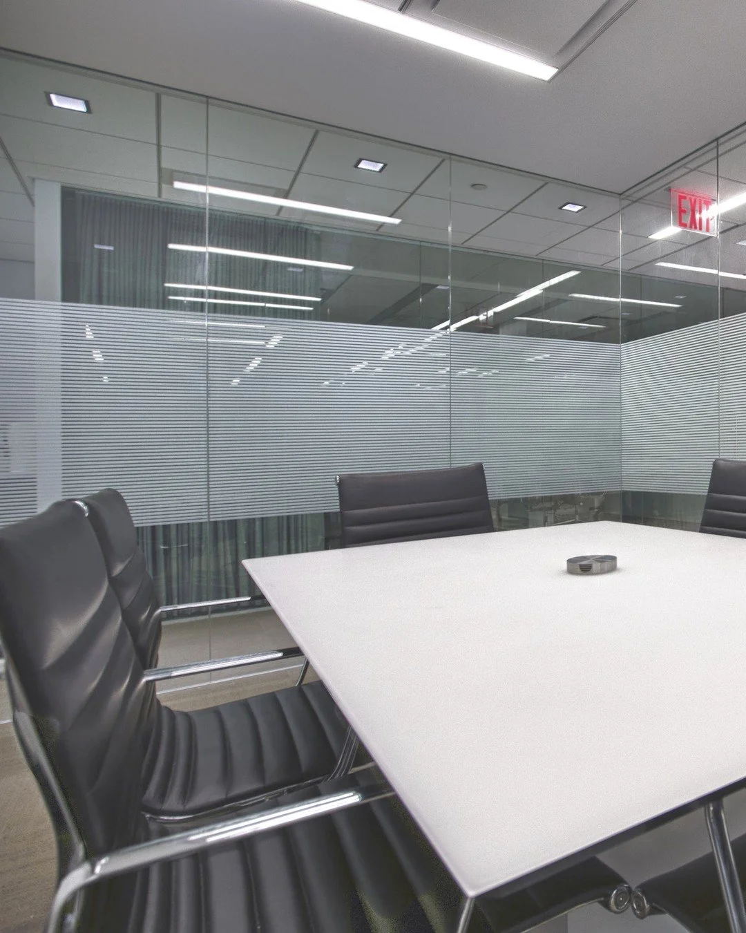 3M Fasara Slat-g adds a band of fine horizontal lines across a glass meeting room, giving the room privacy from the hallway while the daylight still comes through. The film has the look of etched glass and is applied to the glass already in place.

S