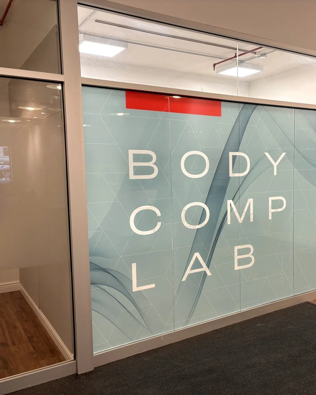 The entry glass at NYC Performance Lab's Body Comp Lab features the lab's name over a soft smoke pattern, printed on our Chroma film. Chroma films are designed and printed in house on our SwissQprint, which allows us to produce a logo, artwork or cus