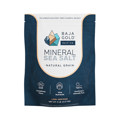 A mostly navy, gold, and white package of Baja Gold Mineral Salt — Natural Grain variety.