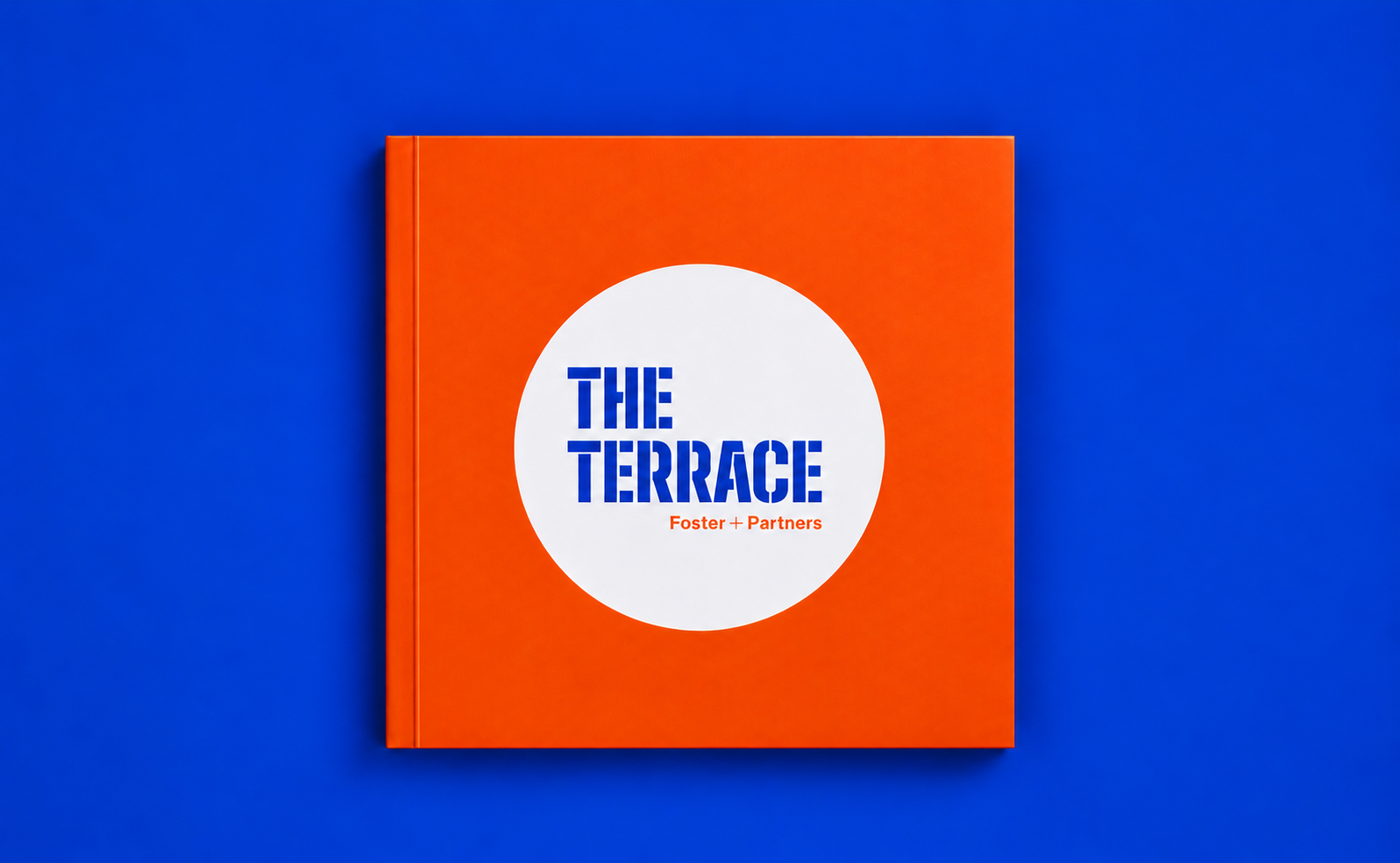 The Terrace bespoke quare book with orange cover and die cut to see title through.