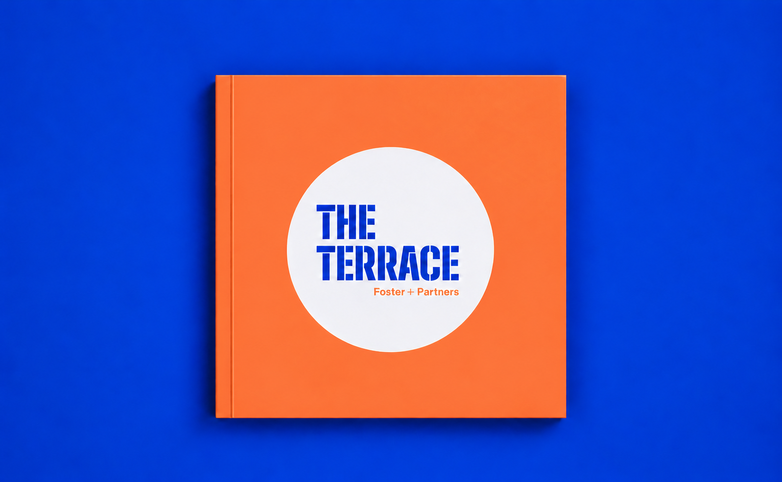 The Terrace bespoke square book with orange cover and die-cut a die-cut opening revealing the title.