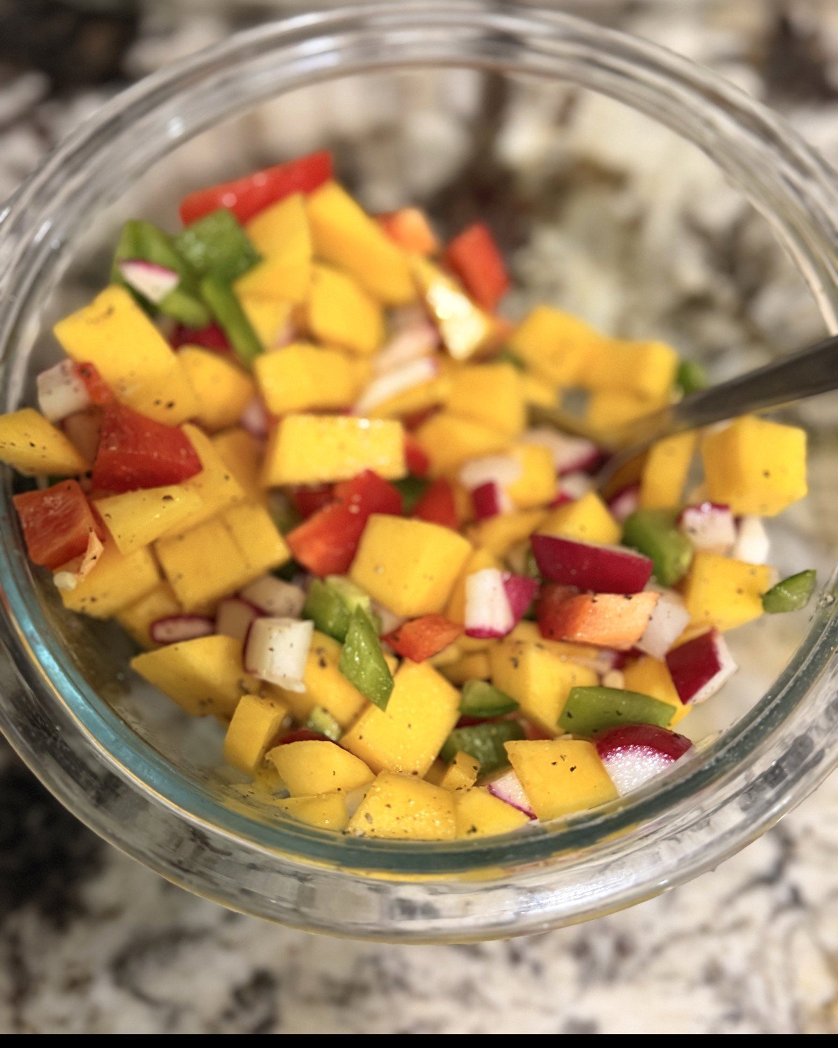 Bowl of mango, radish, jalapeño and bell pepper salsa