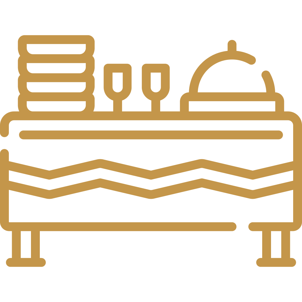 Line drawing of a hotel buffet table with plates, glasses, a serving dome, and tablecloth.