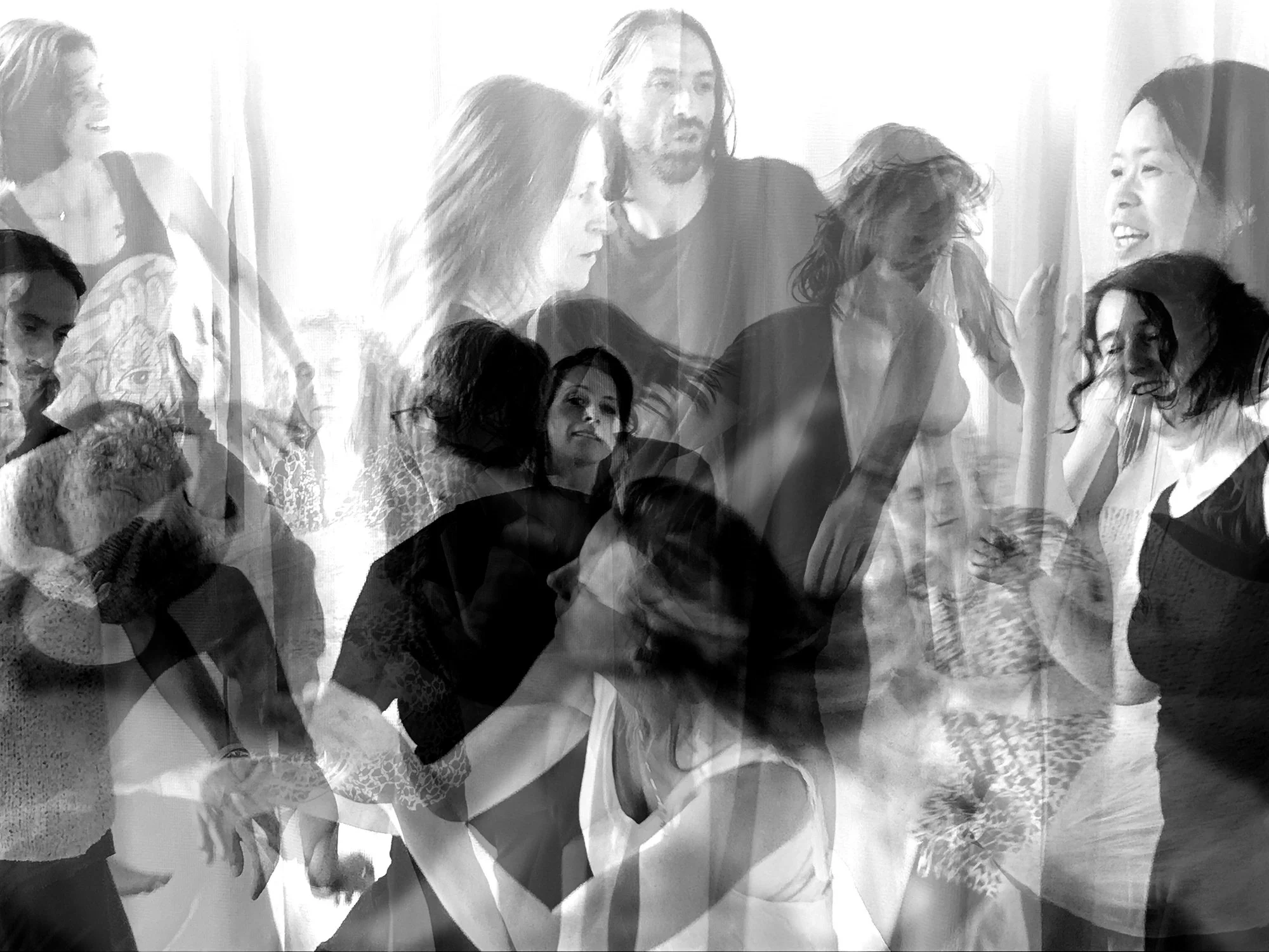 Block photo of a group of people moving together in a light-filled space.