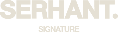 Text graphic with the words 'SERHANT.' in large bold letters and 'SIGNATURE' underneath in smaller font.
