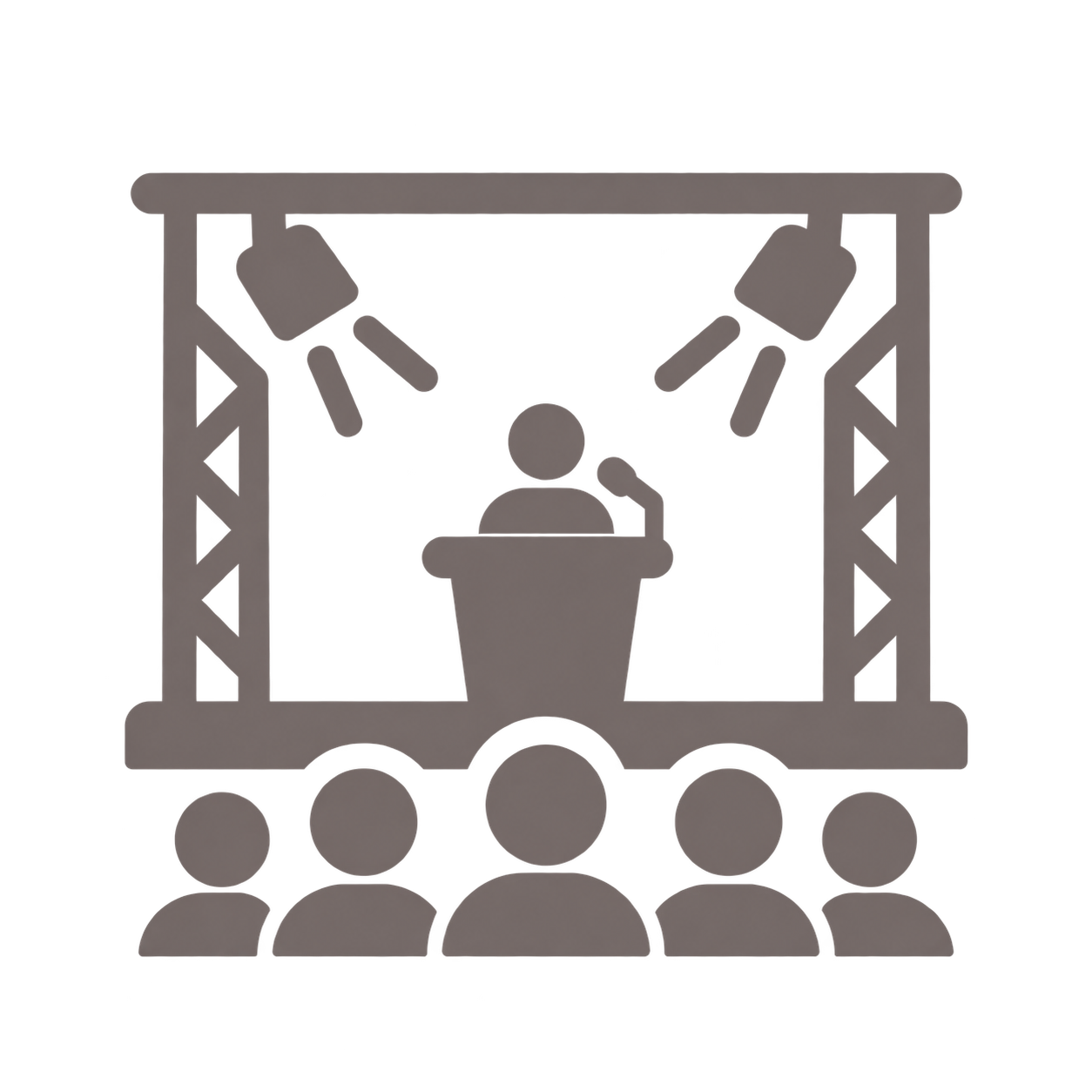 Silhouette eines Redners an einem Pult, umgeben von Scheinwerfern, vor einem Publikum, das im Schatten sitzt.