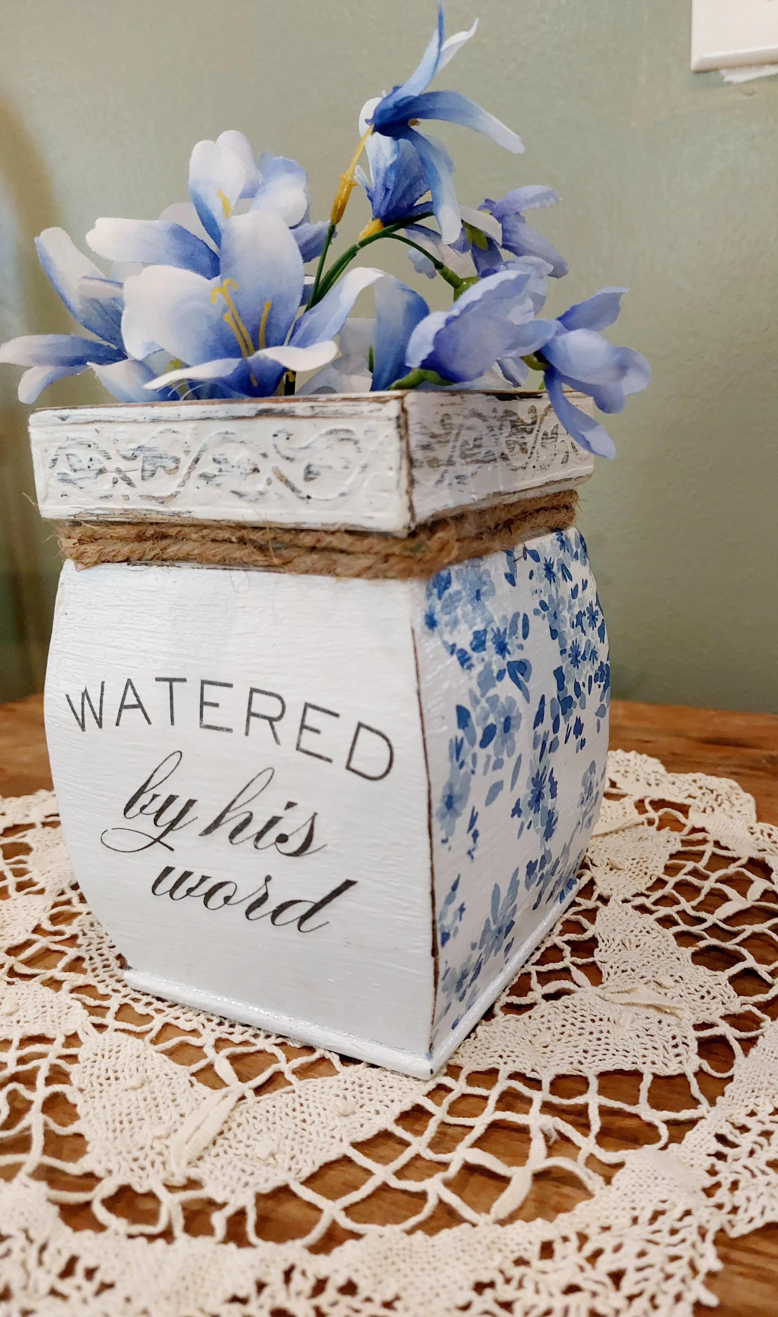 Homemade distressed, decoupage flower holder.