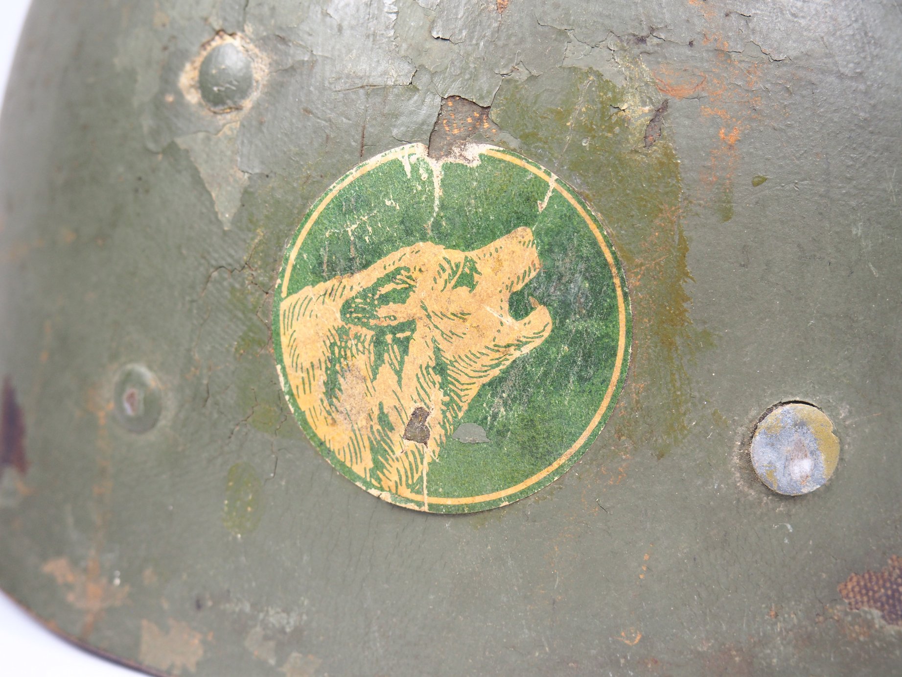 Close up on the application method of this decal. The 104th Division Timberwolf was cut out from paper and a layer of glue was applied over it.