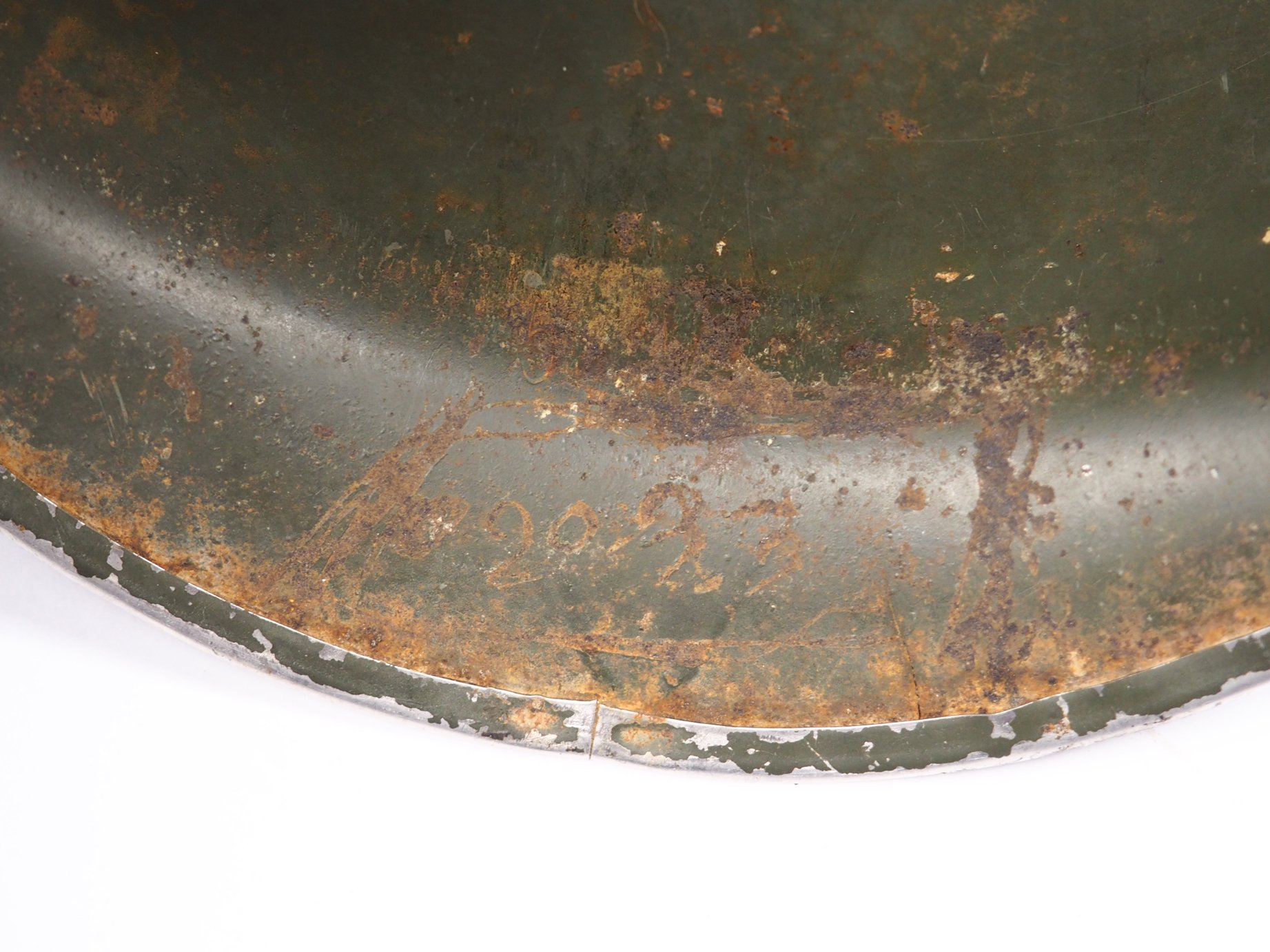 Tec/5 O'Rourke's laundry number scratched into the brim of the helmet shell.