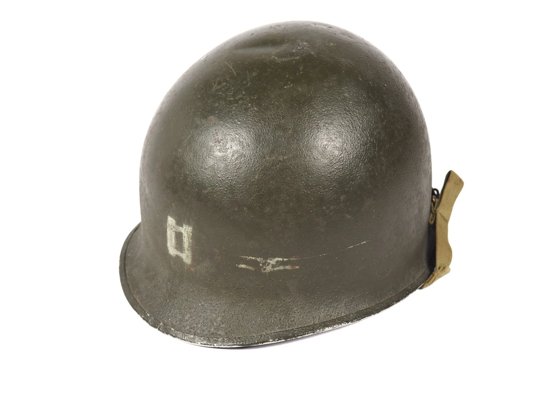 Remnants of a tape residue on the side of the helmet can be seen. Nothing in his records indicate what the white stripe signifies, and generally, a horizontal stripe along the entire helmets signifies Military Police personnel.