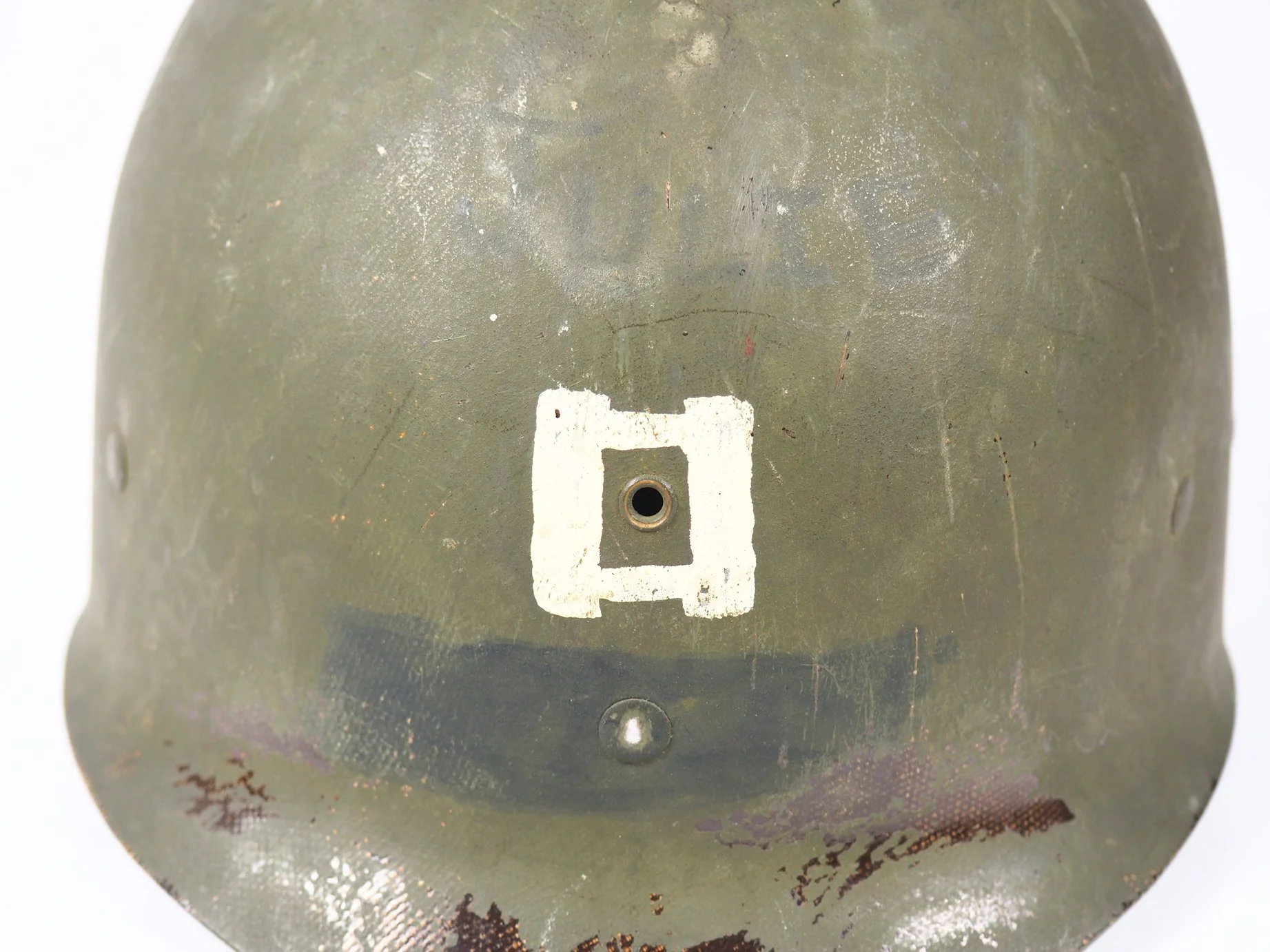 Faintly visible, "JULIE" can be seen painted above the Captain's bars.
