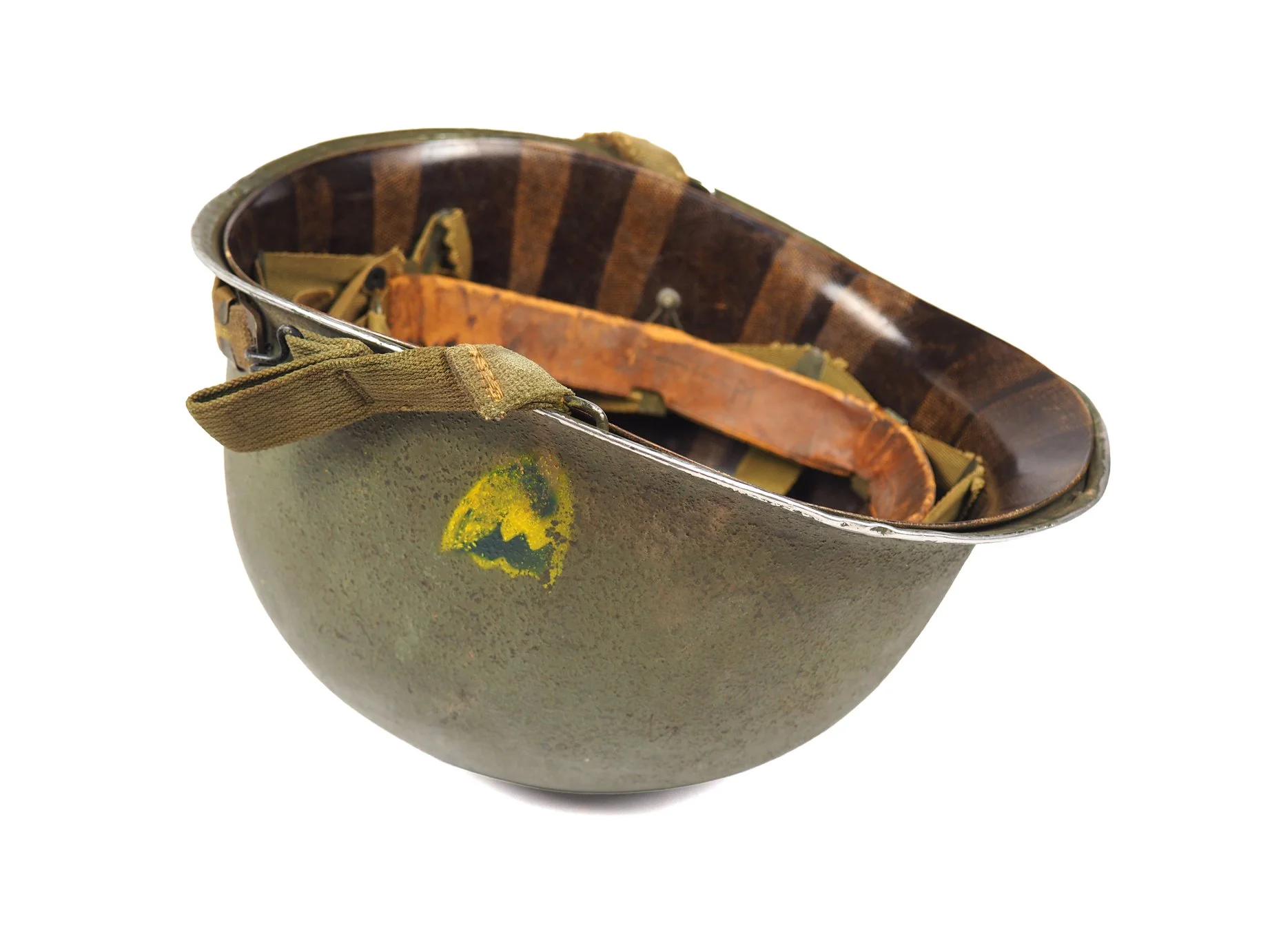 Notice the stitching work on the chinstraps are not factory applied. Given that this helmet is an earlier war model, they were probably applied at a repair depot and re-issued to Edward.