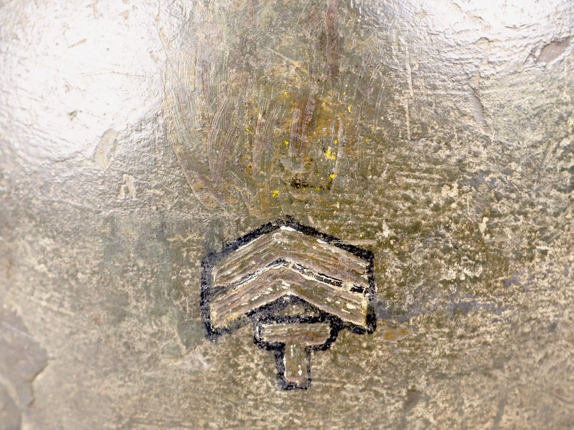 The 347th Infantry's Headquarters Company used a yellow circle as a tactical marking. Rarely are 87th tactical markings seen on helmet shells, and this one was evidently removed by Tec/5 Malmstrom. The Tec/5 insignia was also subdued by removal of wh