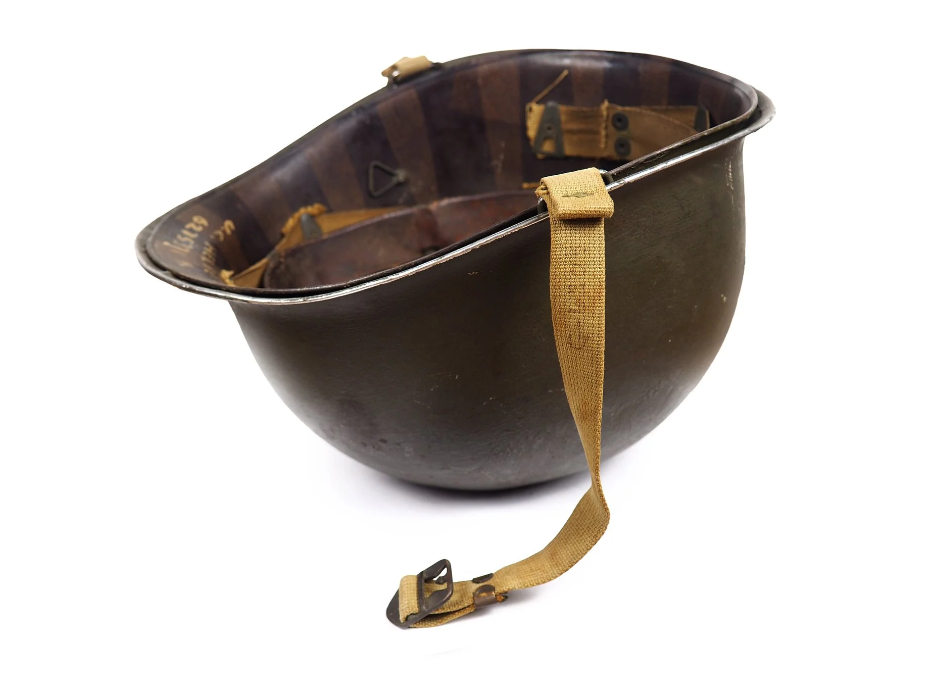 Helbert's helmet was issued to multiple soldiers, as seen by the laundry number on the chinstrap that does not match his.