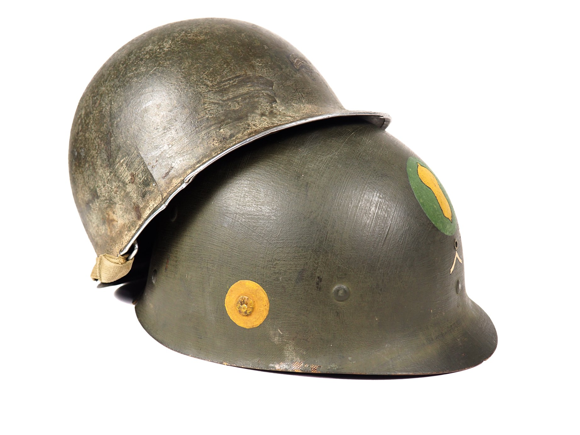 Why might this helmet have PFC insignia and Tec/5 Insignia? The original owner of this helmet acquired it from the estate of a fellow wireman in HQ/347, Richard Harbison, whose highest rank was PFC. Certainly, their equipment had been mixed up at som