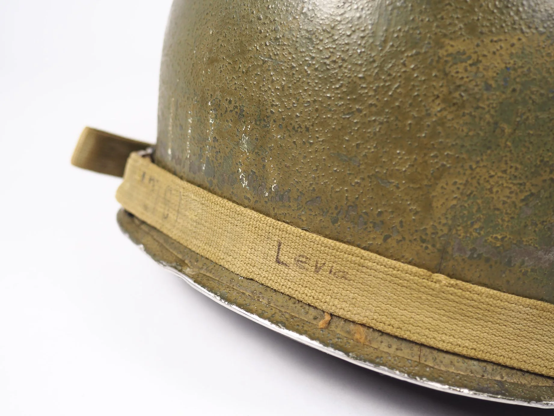 The now partially obscured "108" on the rear of SSgt Levia's helmet, evidently referring to the 108th Infantry Regiment.