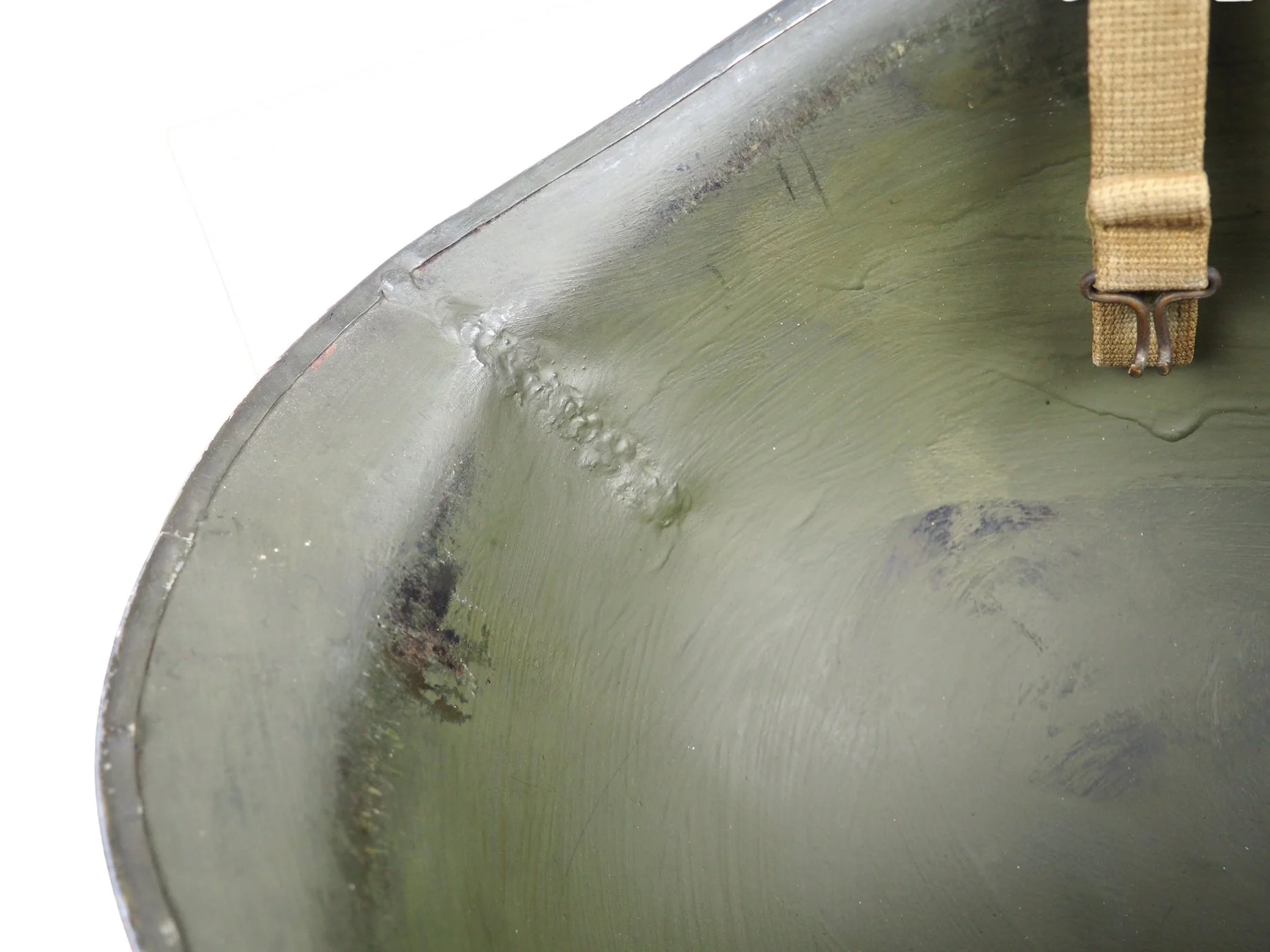 Close up of the weld for all the welding critics out there. Given that the weld is underneath the period repaint, this repair was done during the helmet's service.