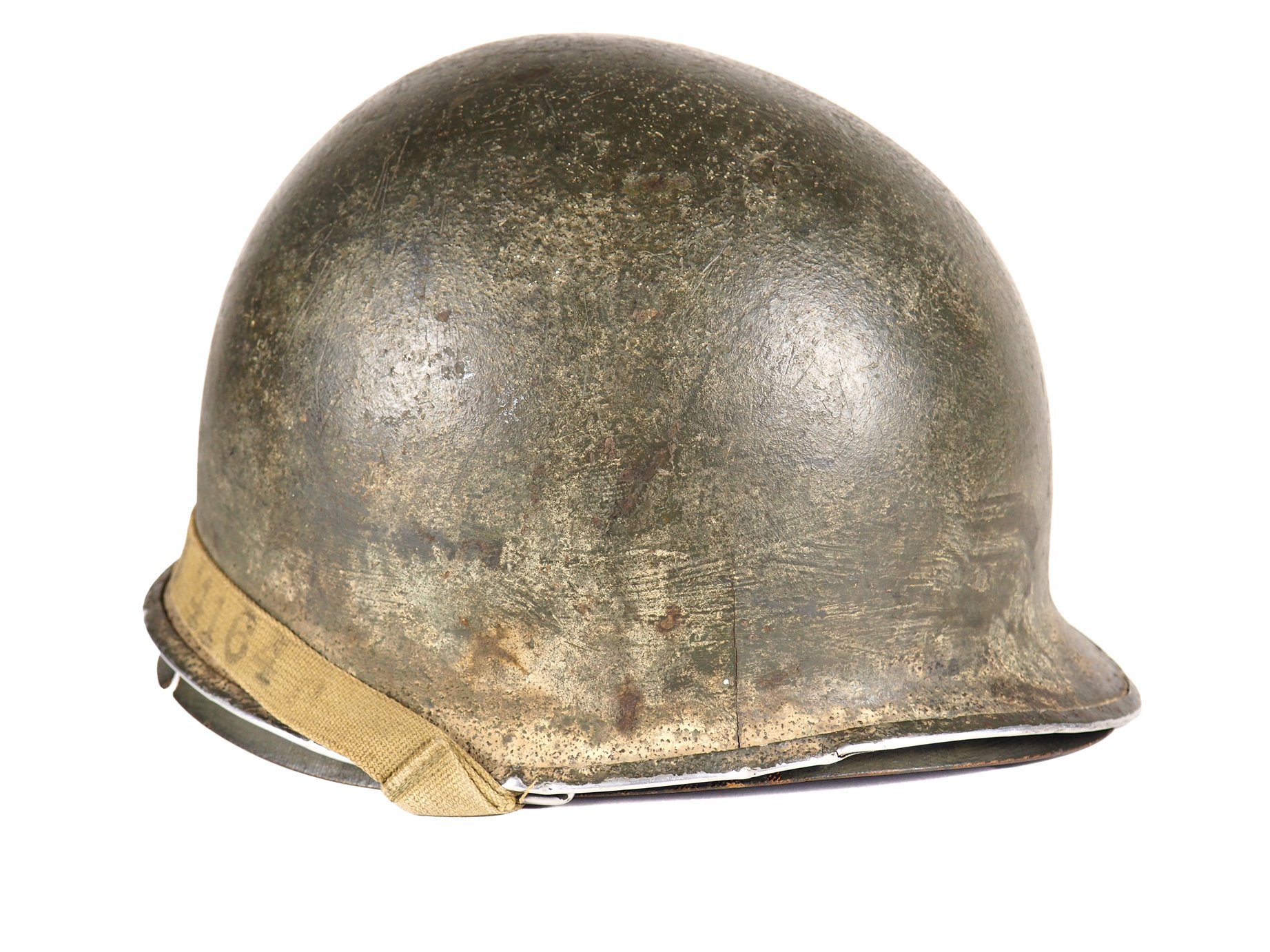 As seen in a few other examples in the museum, this helmet remains caked in mud.