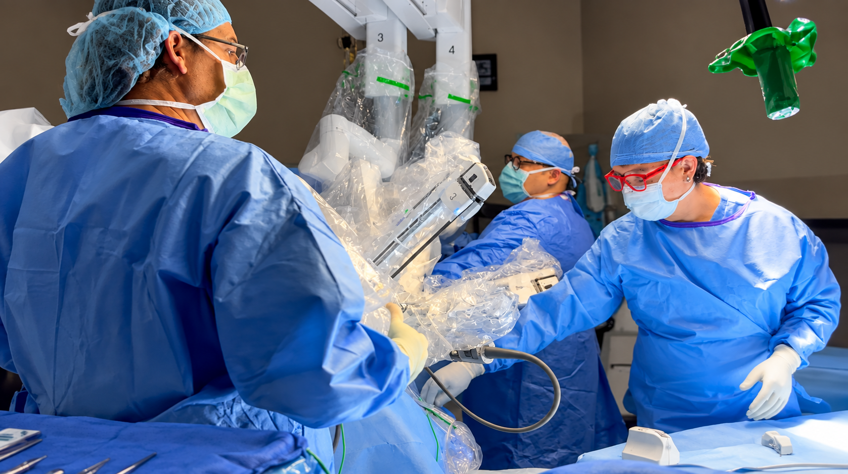 Dr. Shey Ditto participating in a robotic-assisted surgical procedure with a surgical team at ATX Robotic Surgery.