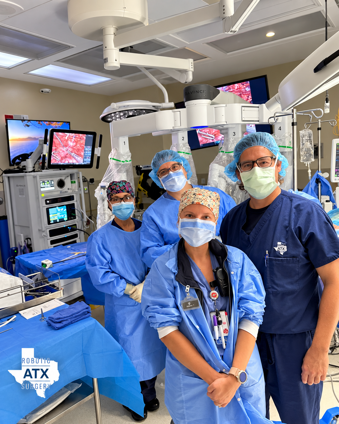 Surgical team in an operating room with robotic-assisted surgical equipment.