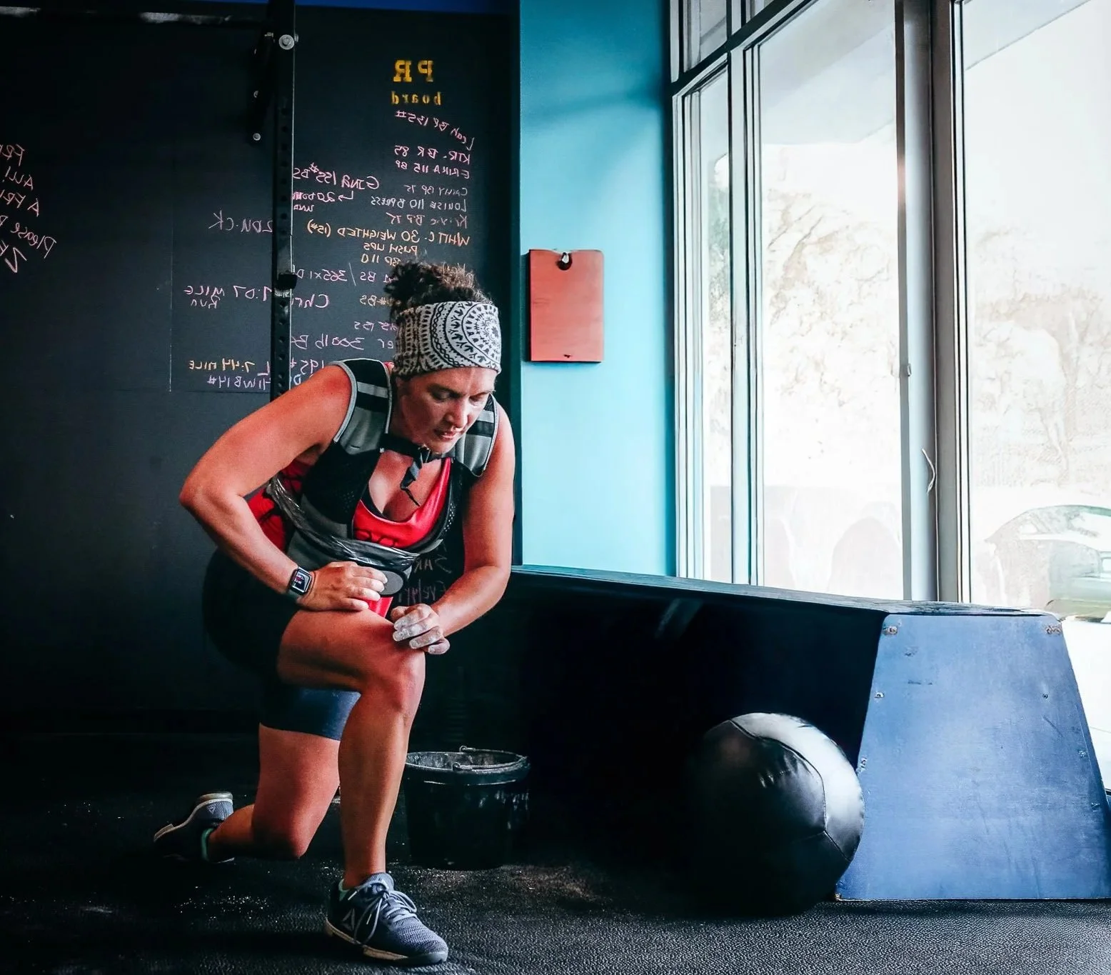 A female murph participant getting up from a pushup round and moving on to the next. Join CFCA and build strength with us