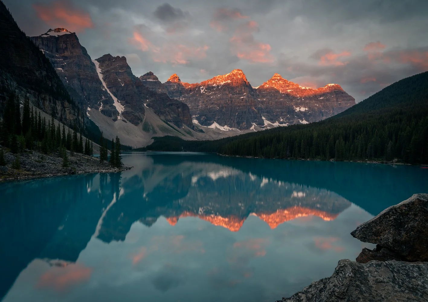 This is a sunrise on the Moraine Lake. One cannot come for sunrise early enough. The parking lot is full an hour before the sunrise. The traffic at this hour on the Moraine Lake road is bumper to bumper (almost).