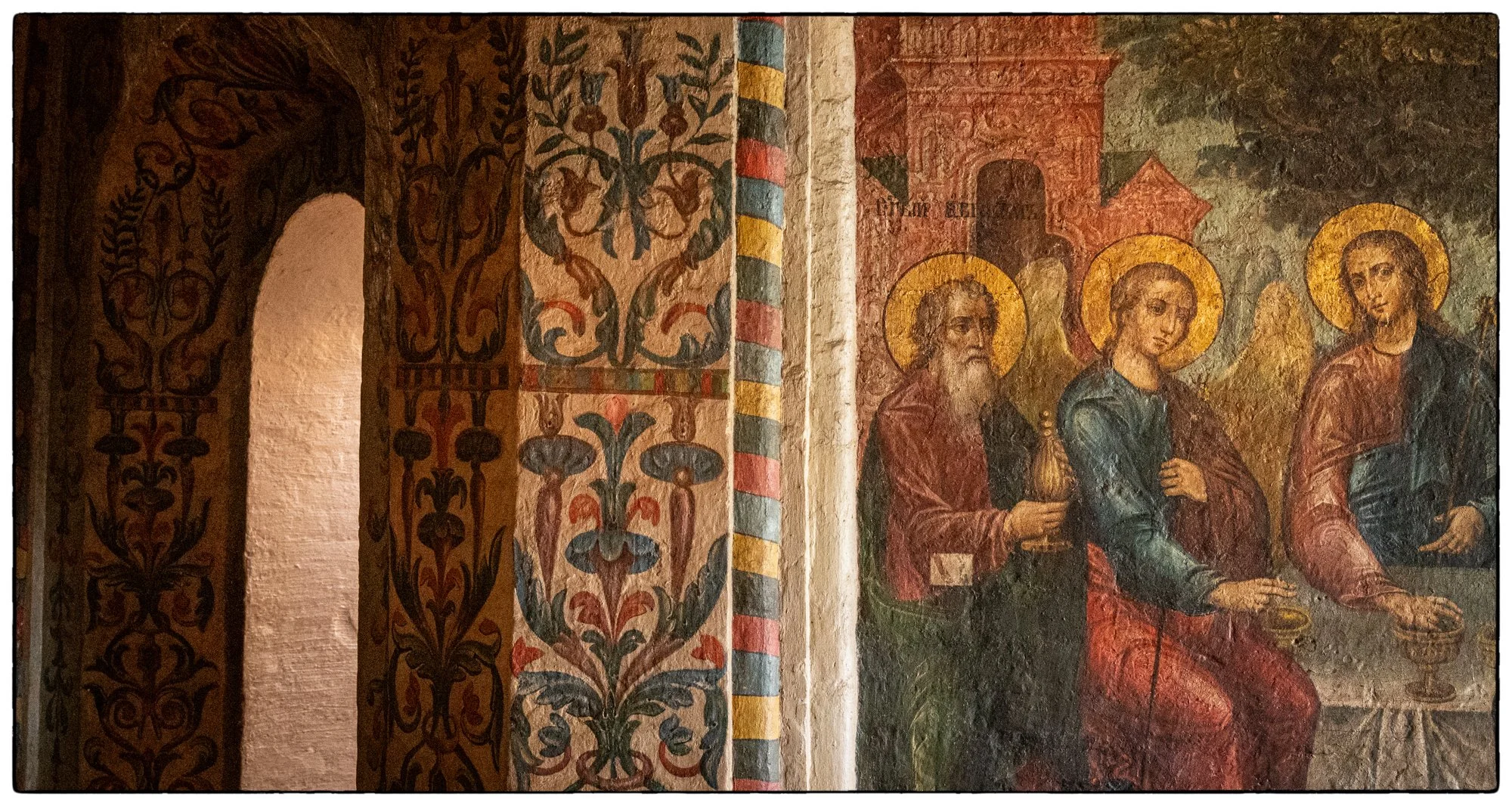 Inside the St. Basil Cathedral. The mural of the Holly Trinity